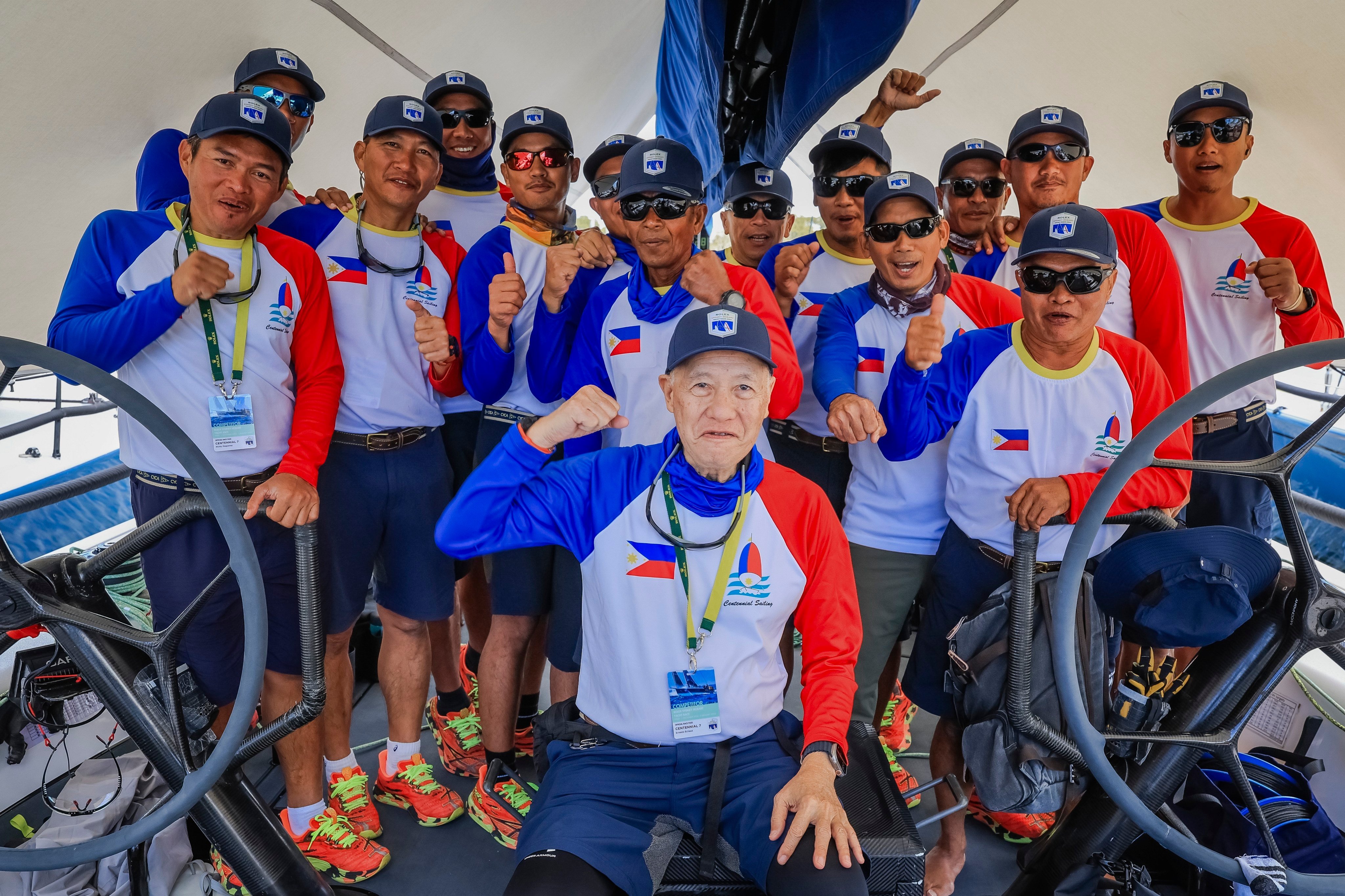 Skipper of Philippines entry Centennial, Ernesto Echauz (centre) alongside his crew ahead of the Sydney to Hobart race. Photo: AP