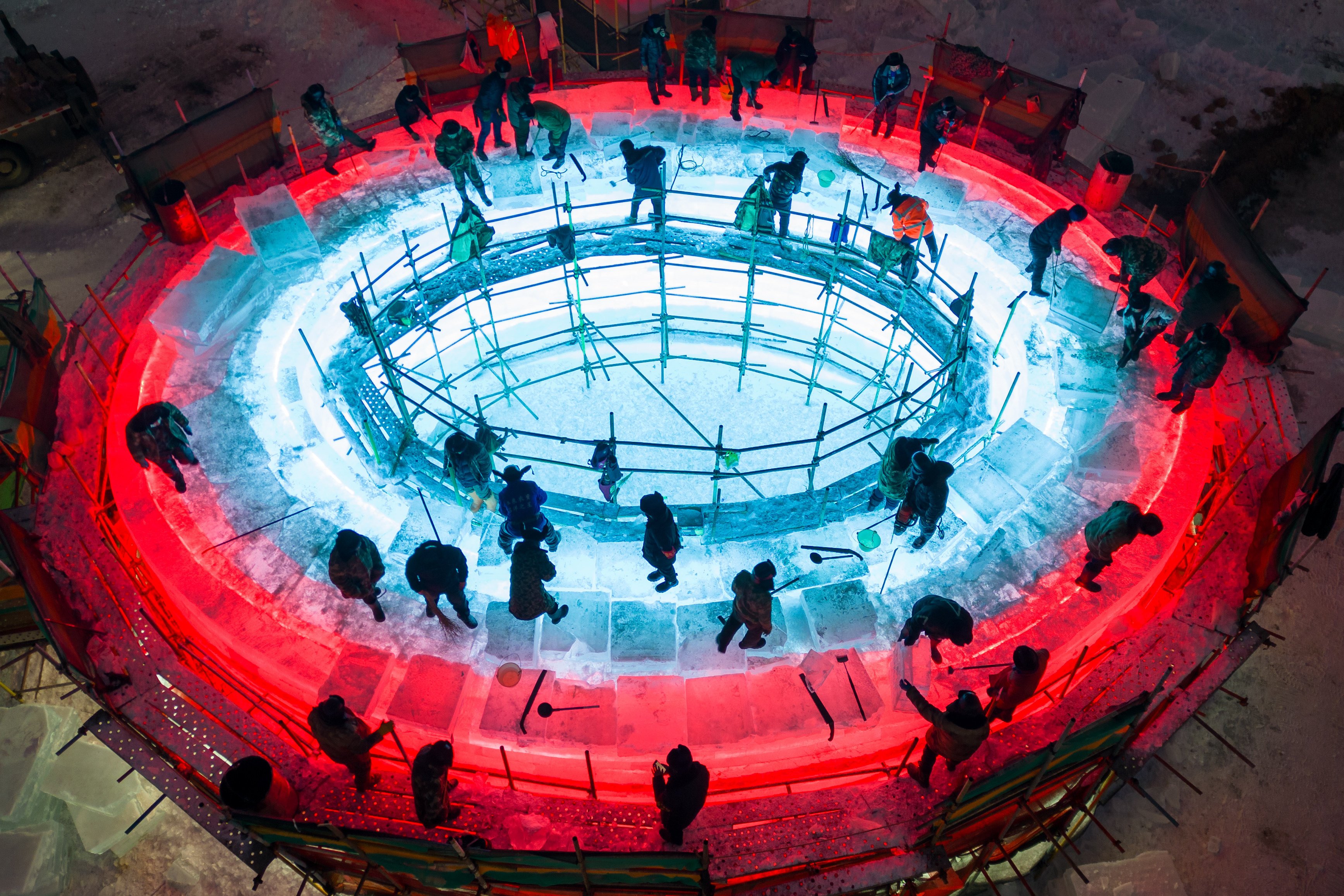 Workers at the Harbin Ice-Snow World construction site in Harbin, Heilongjiang province, on December 9. Photo: Xinhua