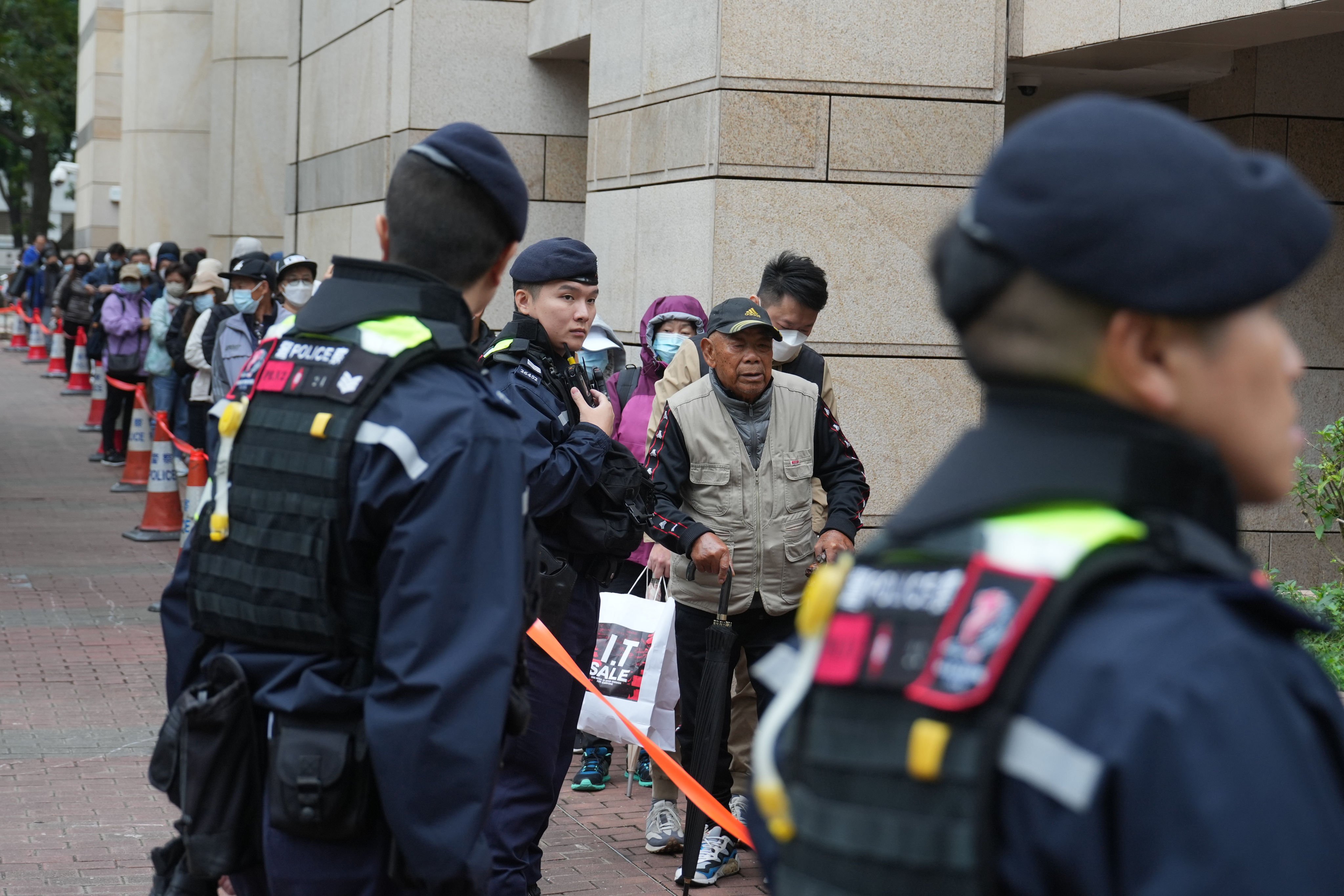 People queue up to enter the  West Kowloon Law Courts Building to hear Jimmy Lai’s national security trial in November. Photo: Sam Tsang