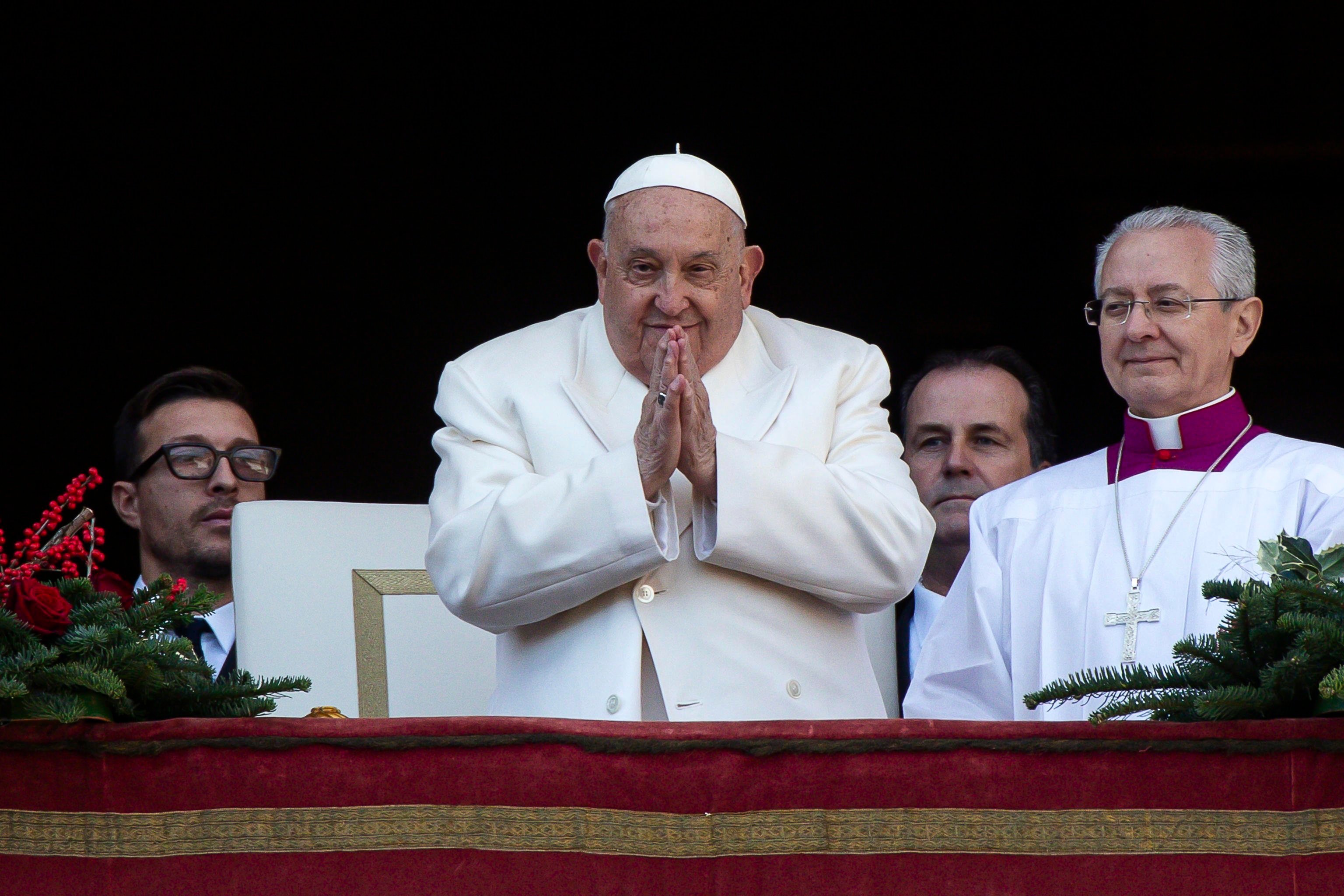 Pope Francis leads the traditional Urbi et Orbi Christmas Day blessing from the central balcony of Saint Peter’s Square. He called for arms to be silenced in war-torn Ukraine and in the Middle East. Photo: EPA-EFE/ANGELO CARCONI