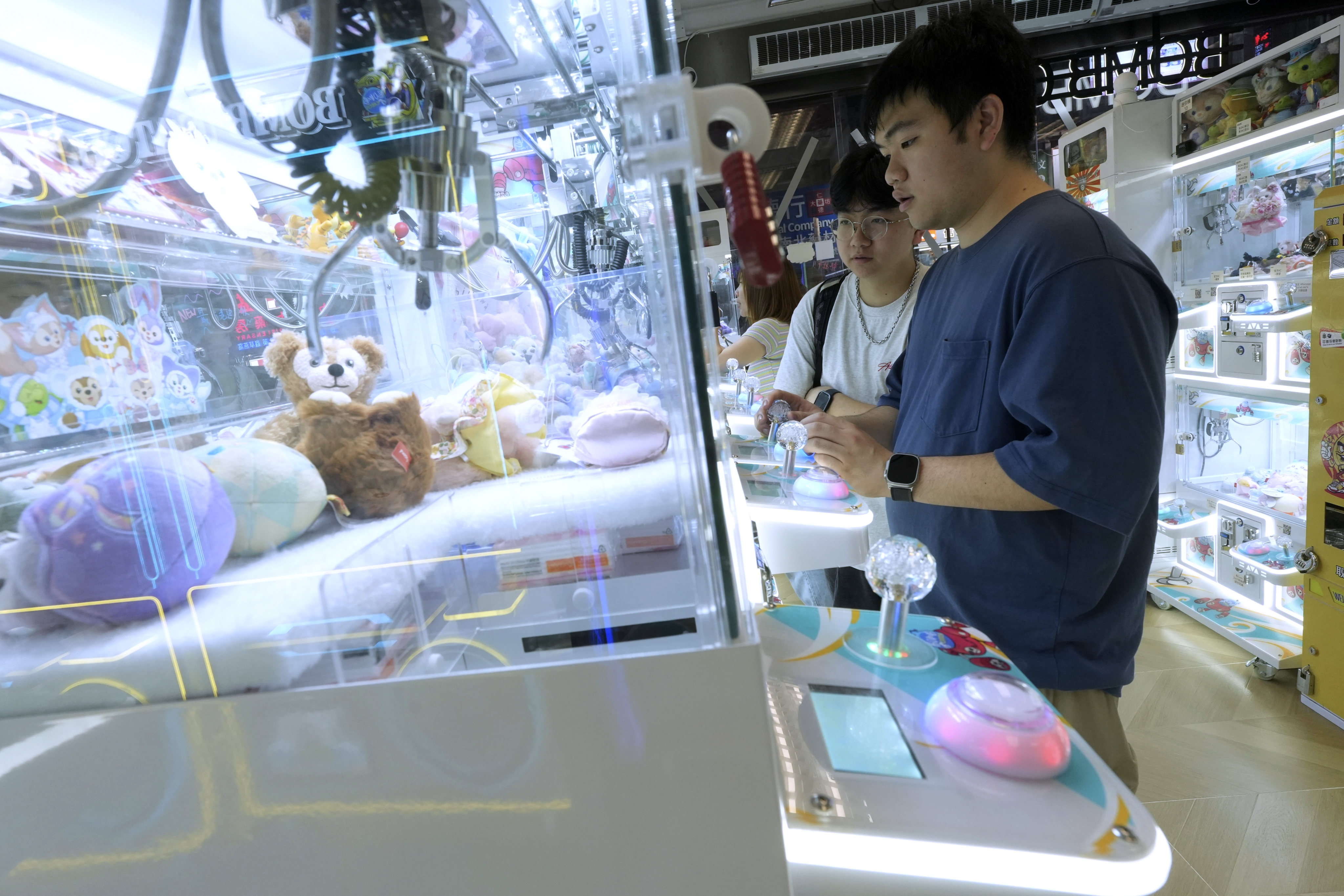 Young residents at a claw machine arcade in Mong Kok. Photo: Sun Yeung