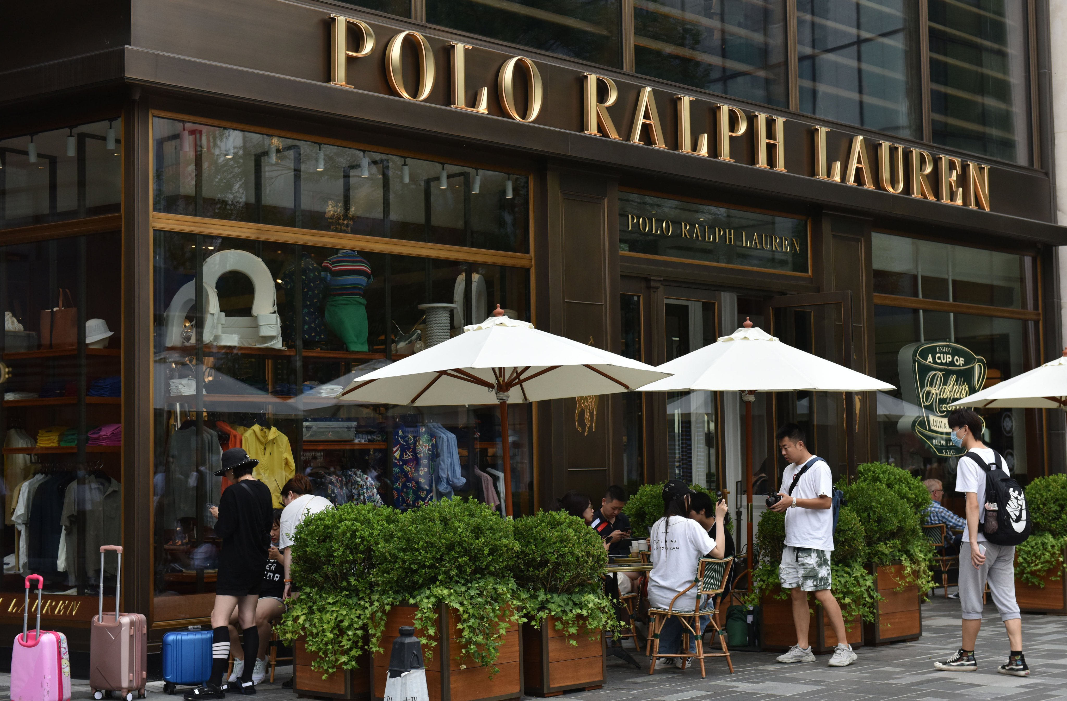 Pedestrians pass in front of the Polo Ralph Lauren store in Beijing in July 2021. Photo: Getty Images