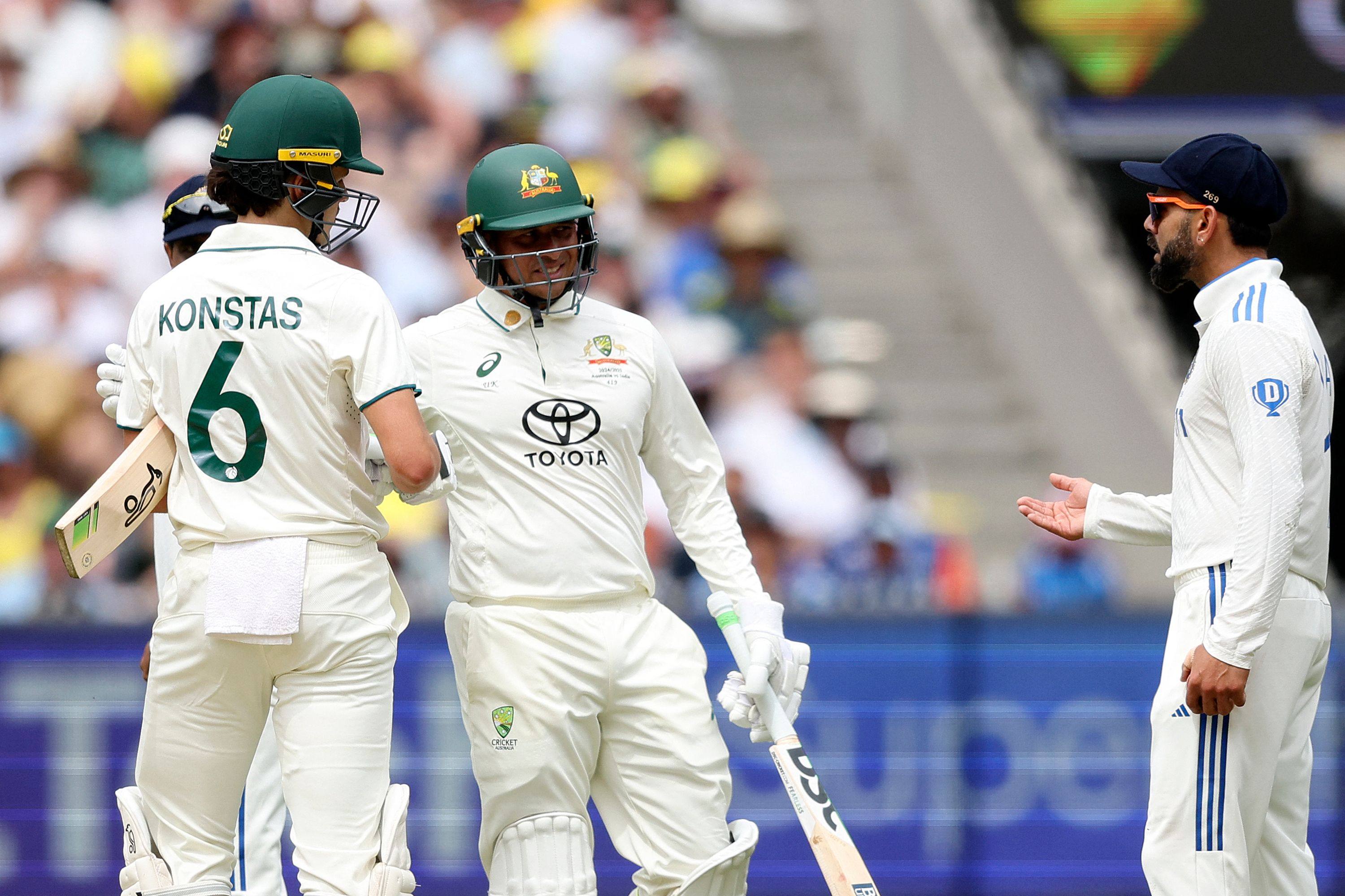 Australia’s Sam Konstas (left) having a chat with India’s Virat Kohli (right) on day one of the fourth cricket Test at the Melbourne Cricket Ground on Thursday. Photo: AFP