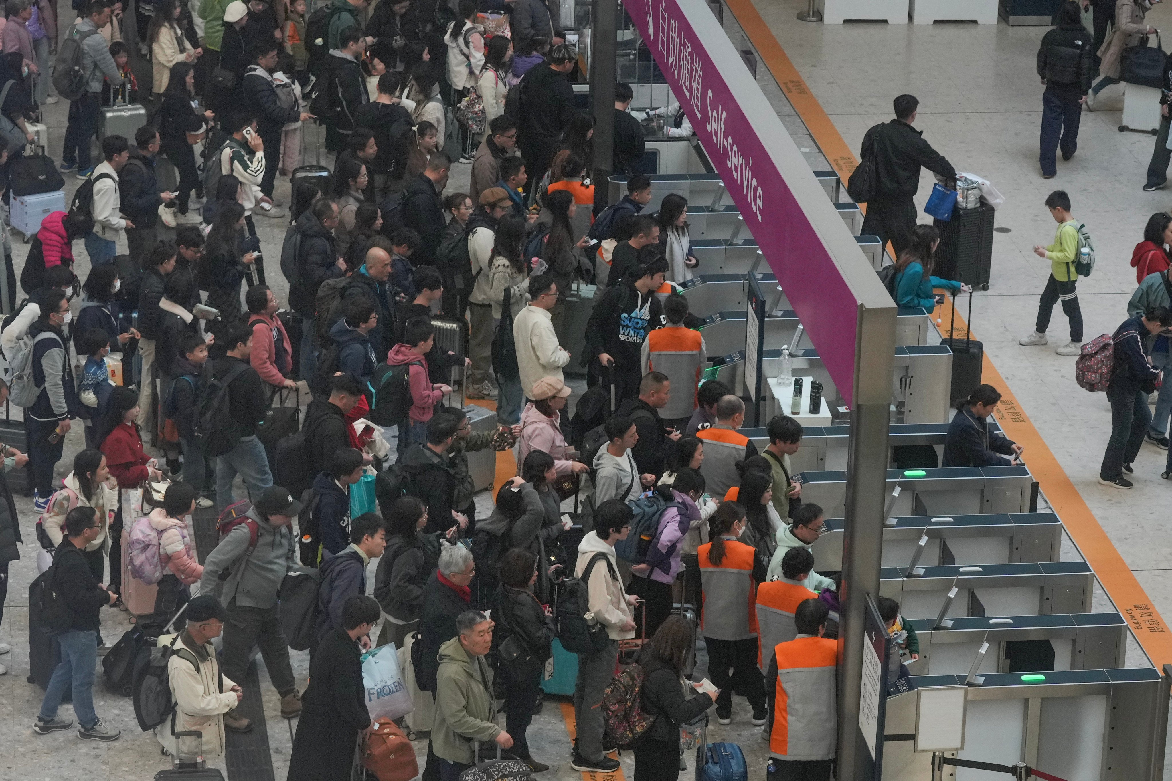 Travellers at the departure hall for the West Kowloon High Speed Rail Station. Photo: May Tse