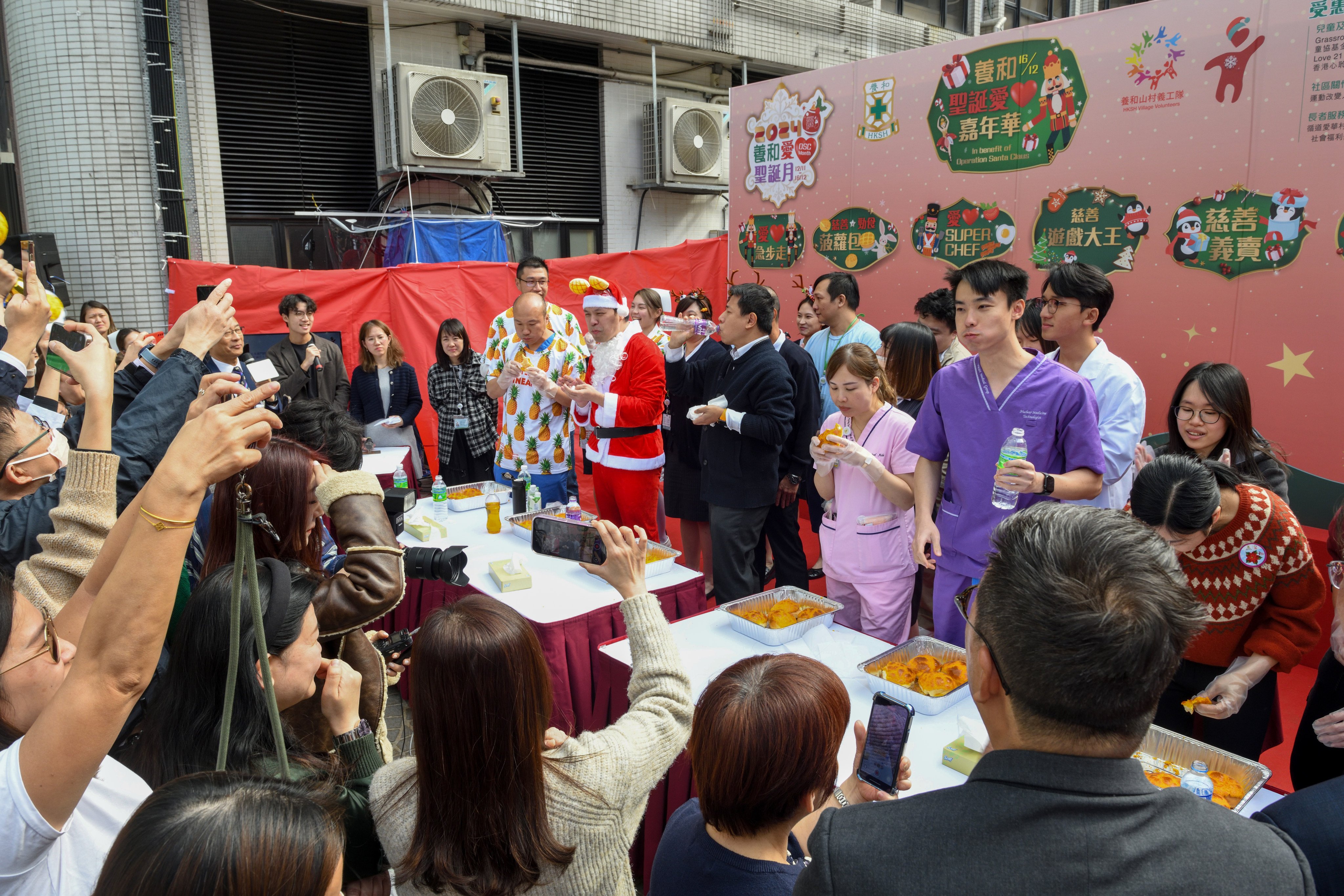 As fundraising for OSC, Excitement mounted as medical teams squared off to at the Pineapple Bun Eating Contest. &#xA; Photo: Lam Lui Kong