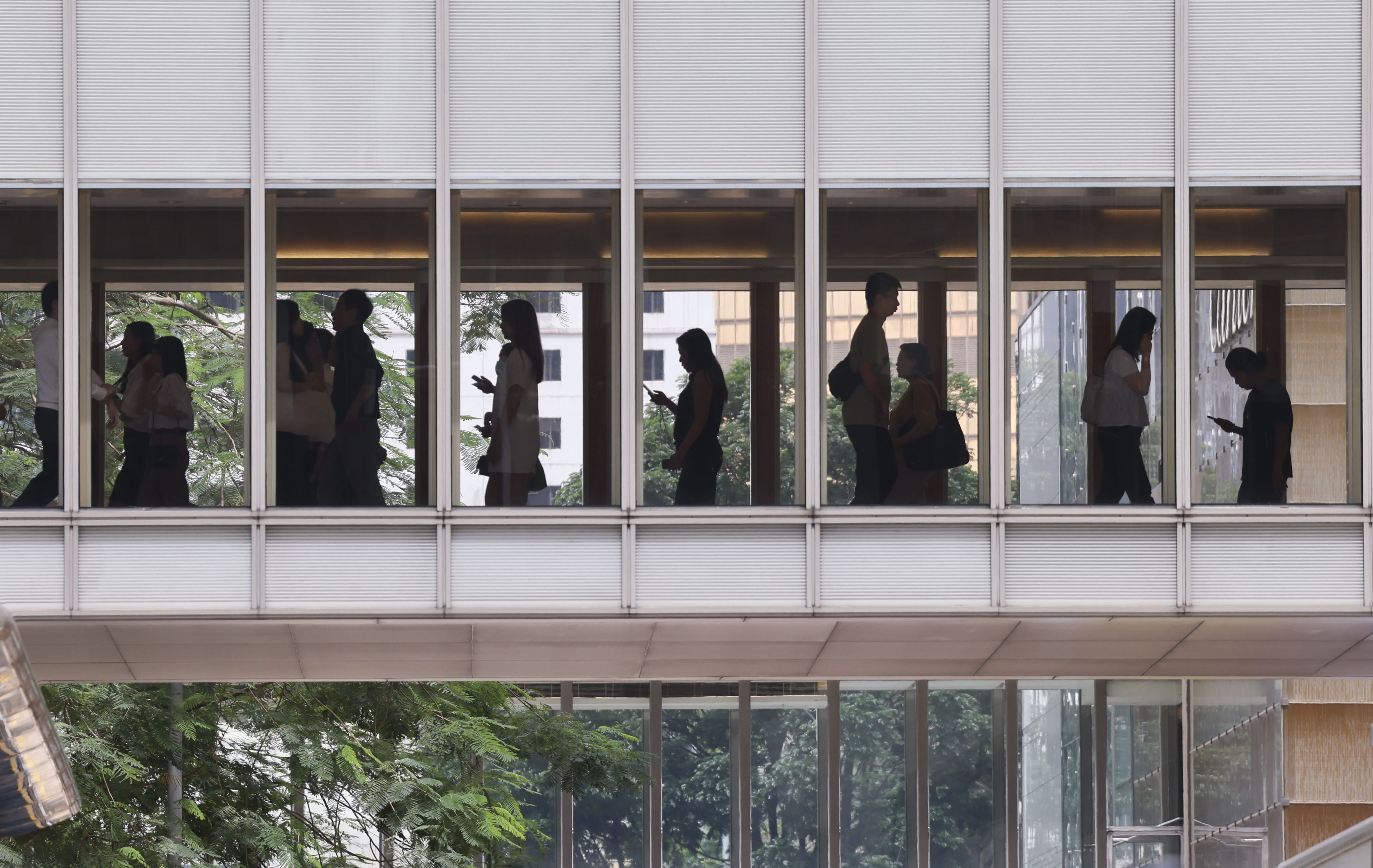 People walked on a footbridge in Central. Photo: Jelly Tse