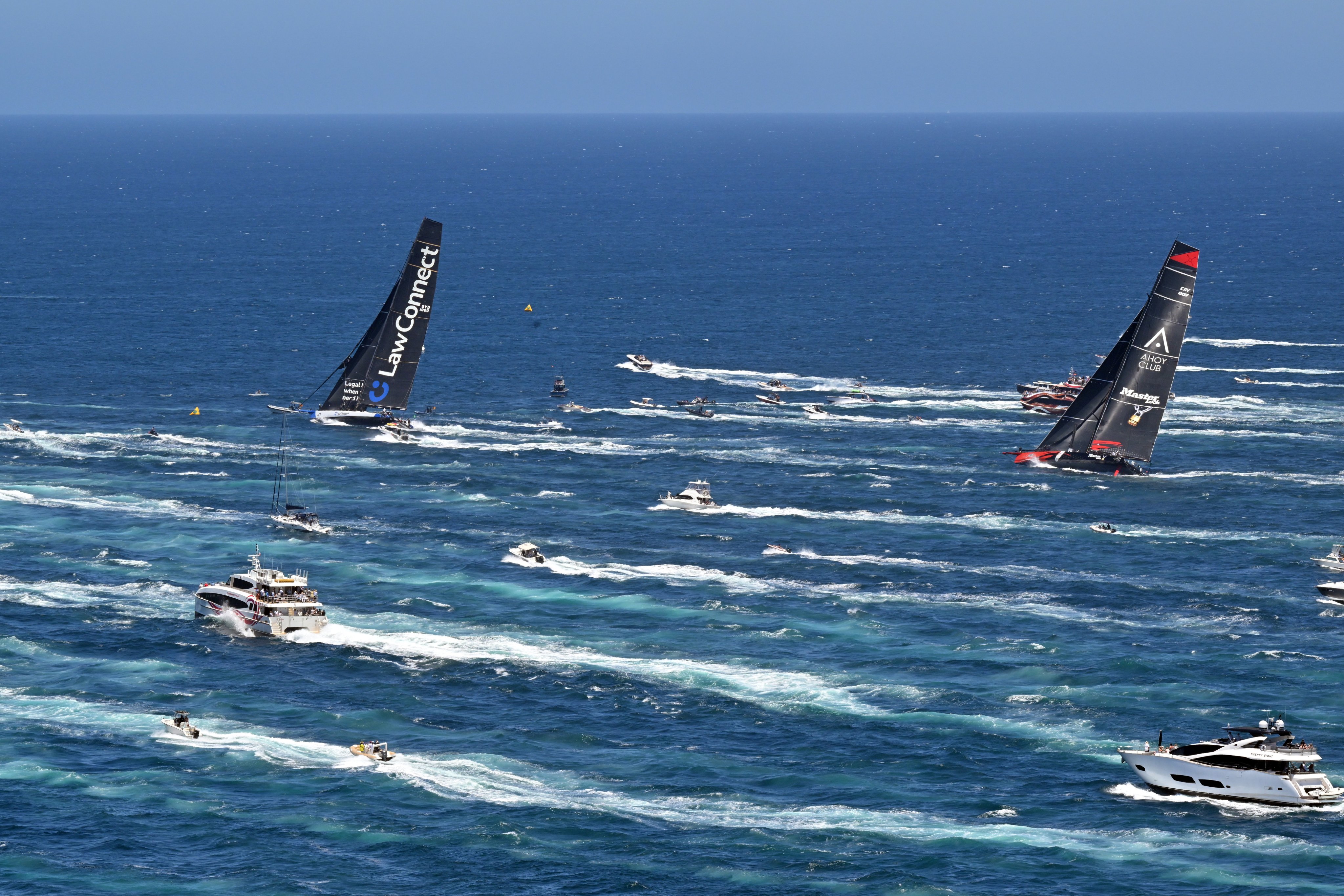 LawConnect (left) and Master Lock Comanche taking the early lead in the 2024 Sydney to  Hobart yacht race in Sydney on Thursday. Photo: EPA-EFE