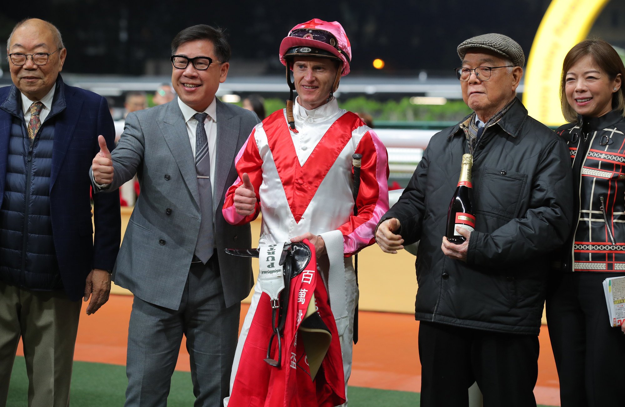 Dennis Yip (second from left), jockey Zac Purton and connections of Noisy Boy celebrate.