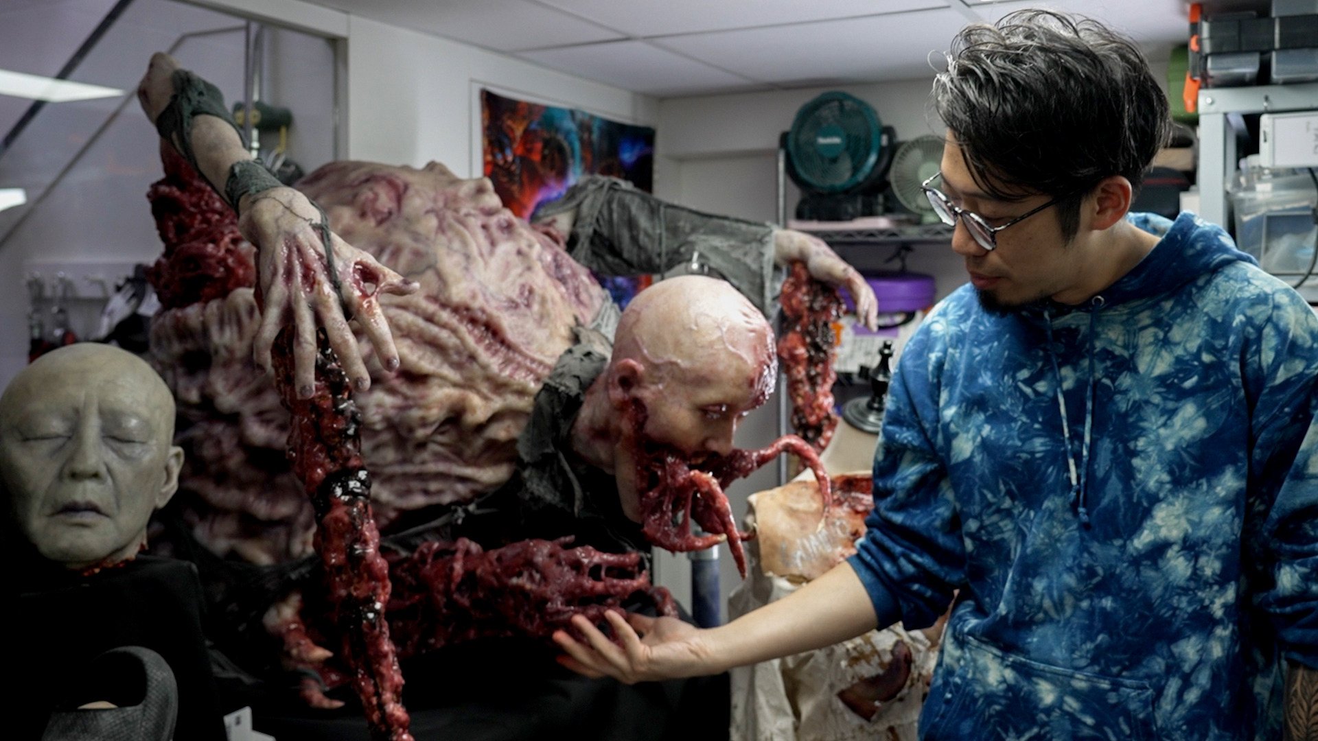 Special effects makeup artist Wilfred Wan with one of his monstrous creations. Photo: SCMP