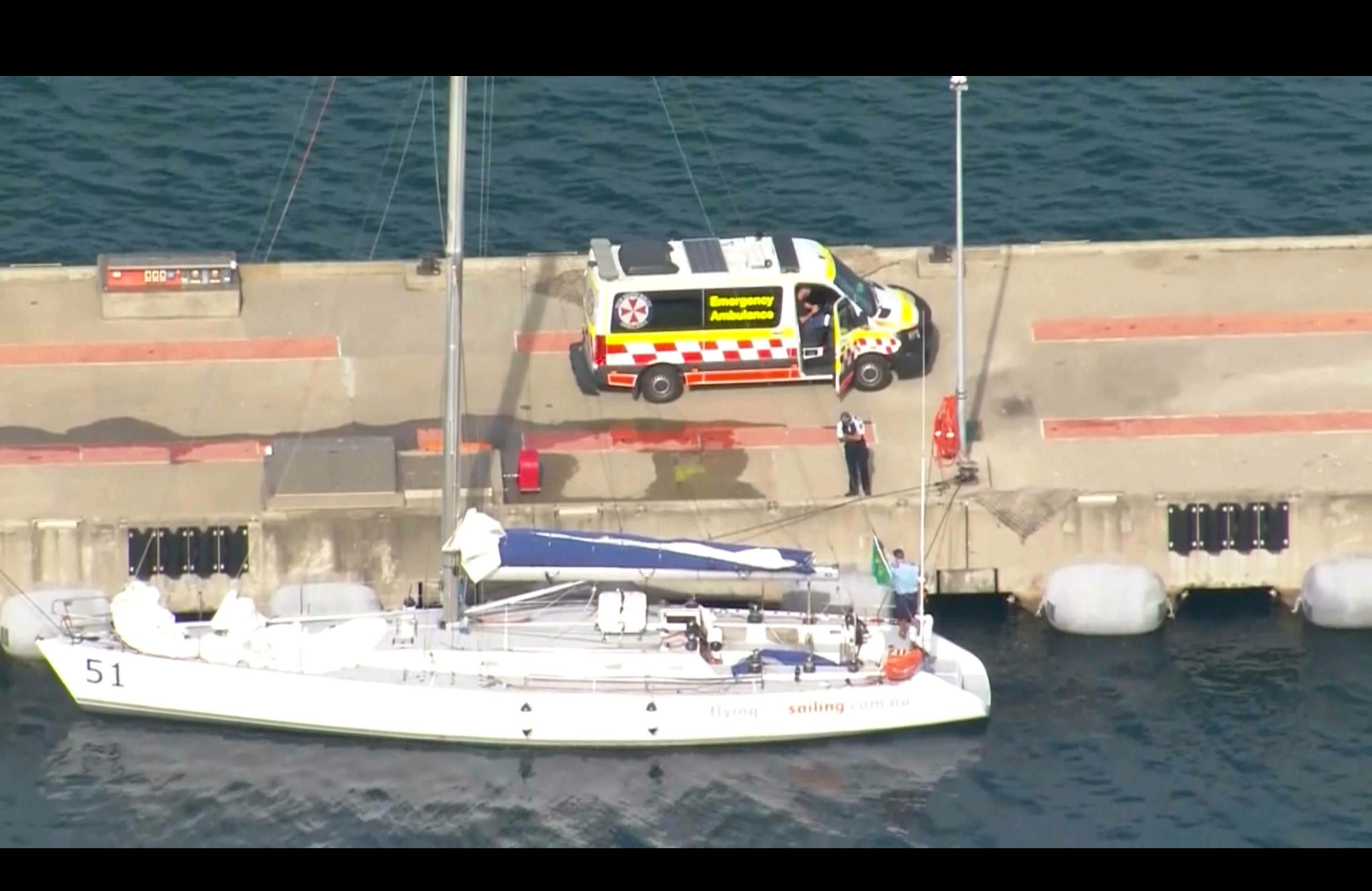 This image made from video provided by several televsion stations shows sailing boat Flying Fish Arctos moored next to an ambulance at Jervis Bay, Australia on Friday. Photo: AP