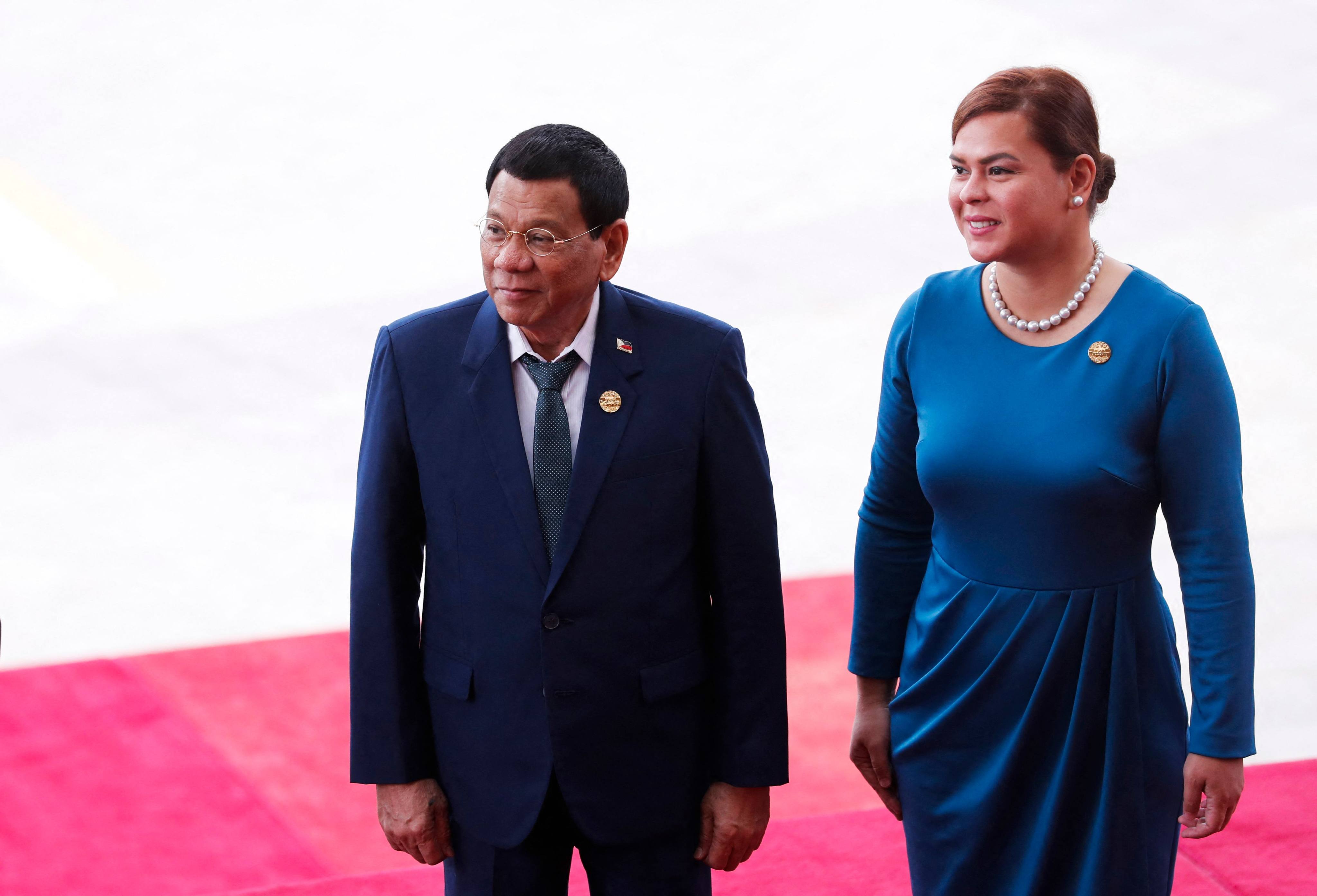 Ex-Philippines President Rodrigo Duterte (left) and his daughter Sara Duterte arrive for the opening of the Boao Forum for Asia on June 19. Photo: AFP