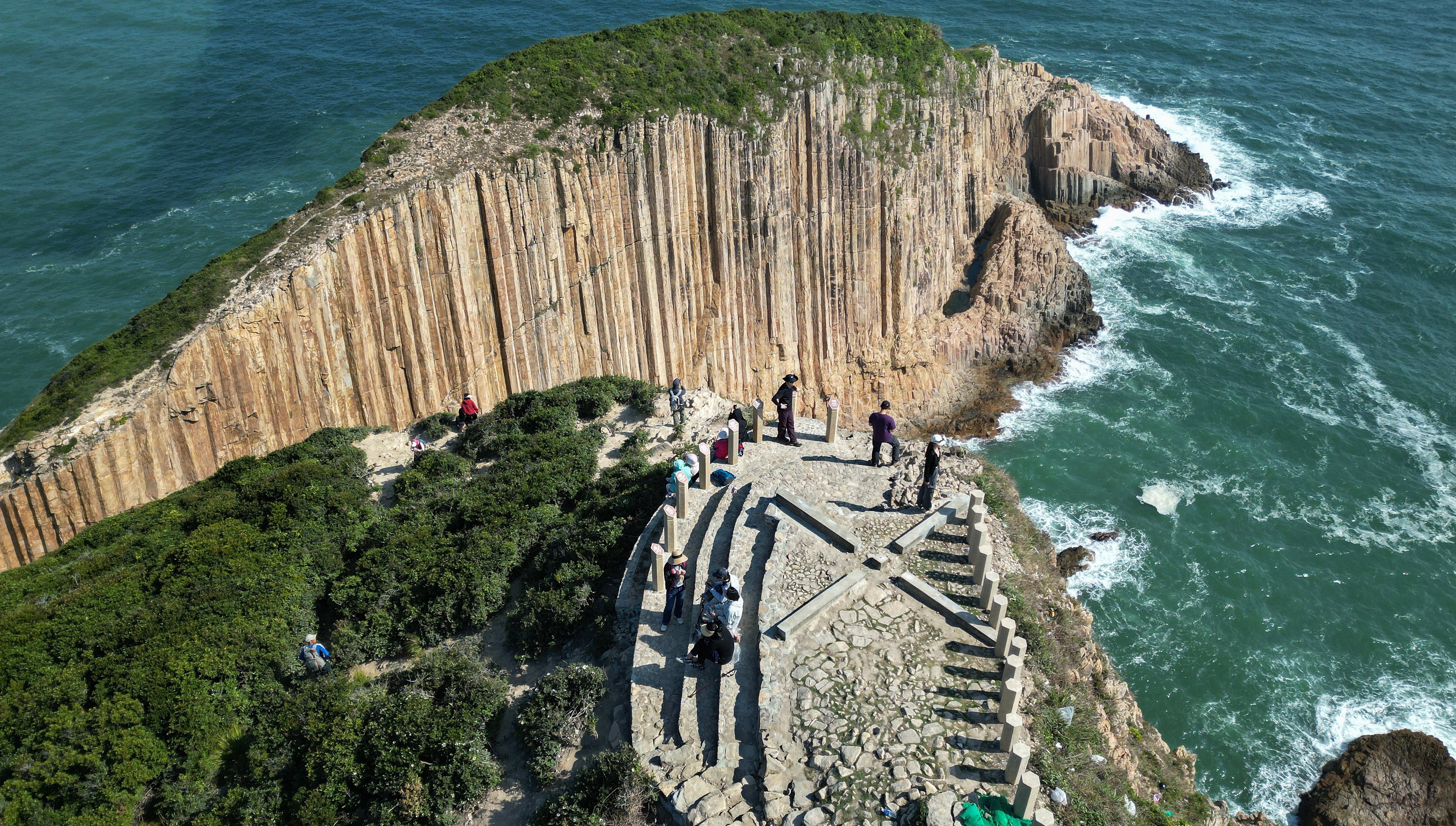 Hikers visit the Po Pin Chau Viewing Platform next to the High Island Reservoir in Sai Kung East Country Park. Photo: Sam Tsang