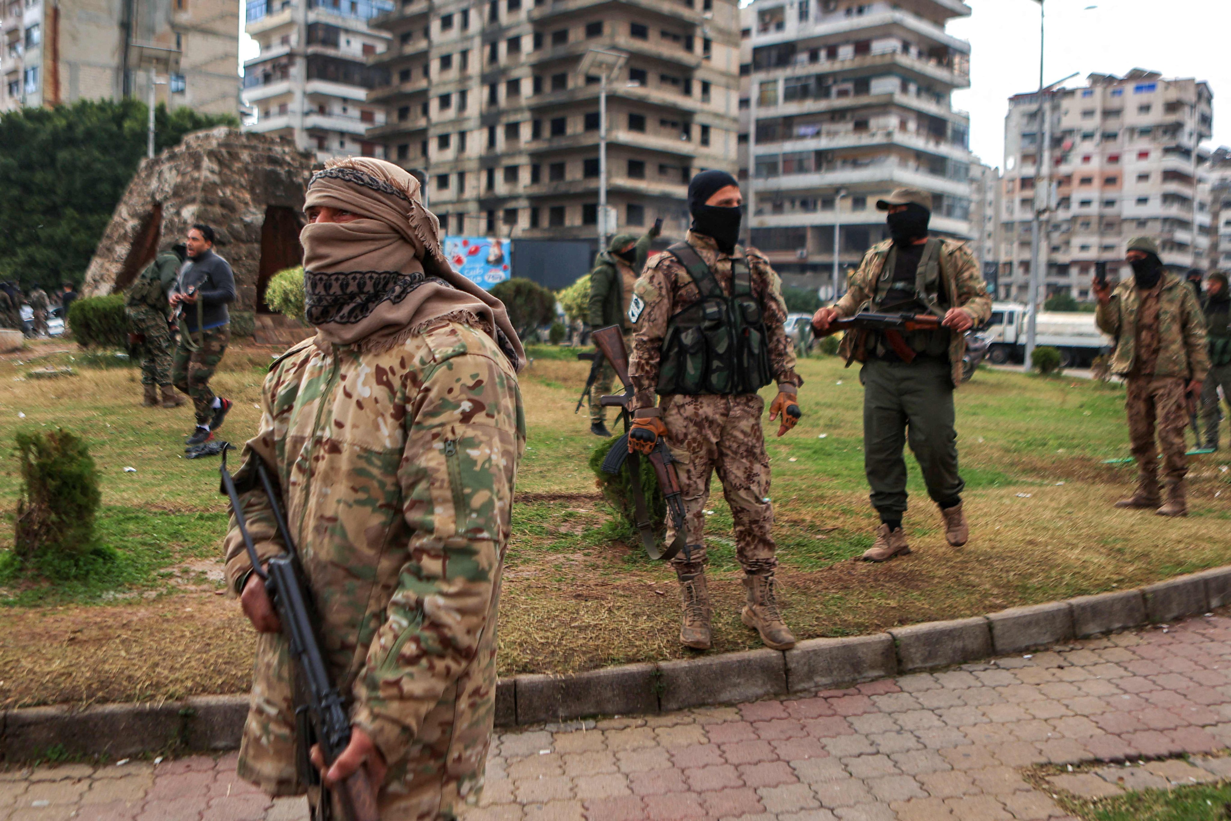 Fighters affiliated with Syria’s new administration in the coastal city of Latakia on Thursday. Syria’s new authorities launched an operation in a stronghold of ousted president Bashar al-Assad on Thursday resulting in deadly fight erupts between security forces ad Assad loyalists. Photo: AFP