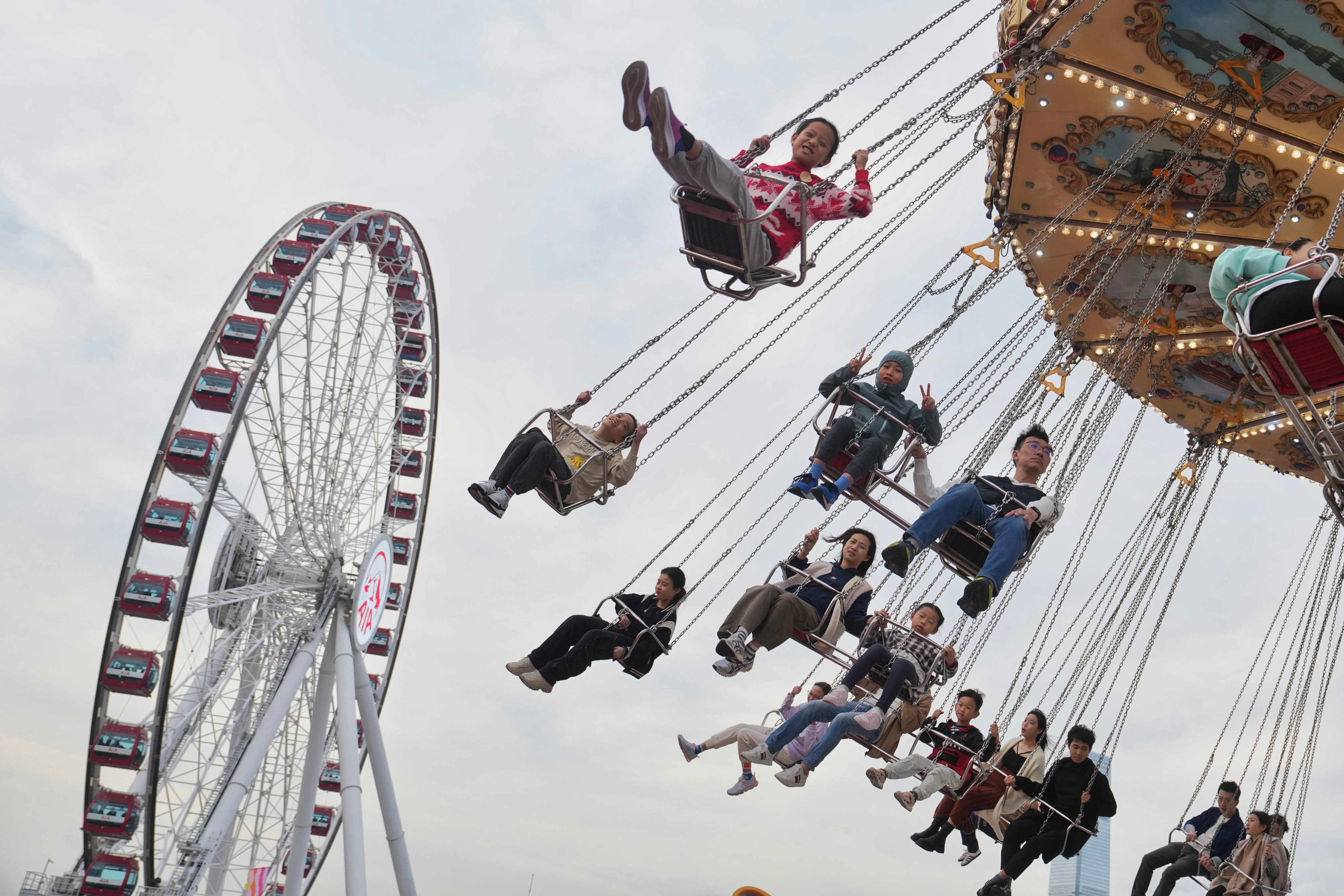 People enjoy a ride at the AIA Carnival on the Central Harbourfront Event Space, one of our picks of the best things to do in Hong Kong on the weekend of December 27-29, 2024. Photo: Elson Li