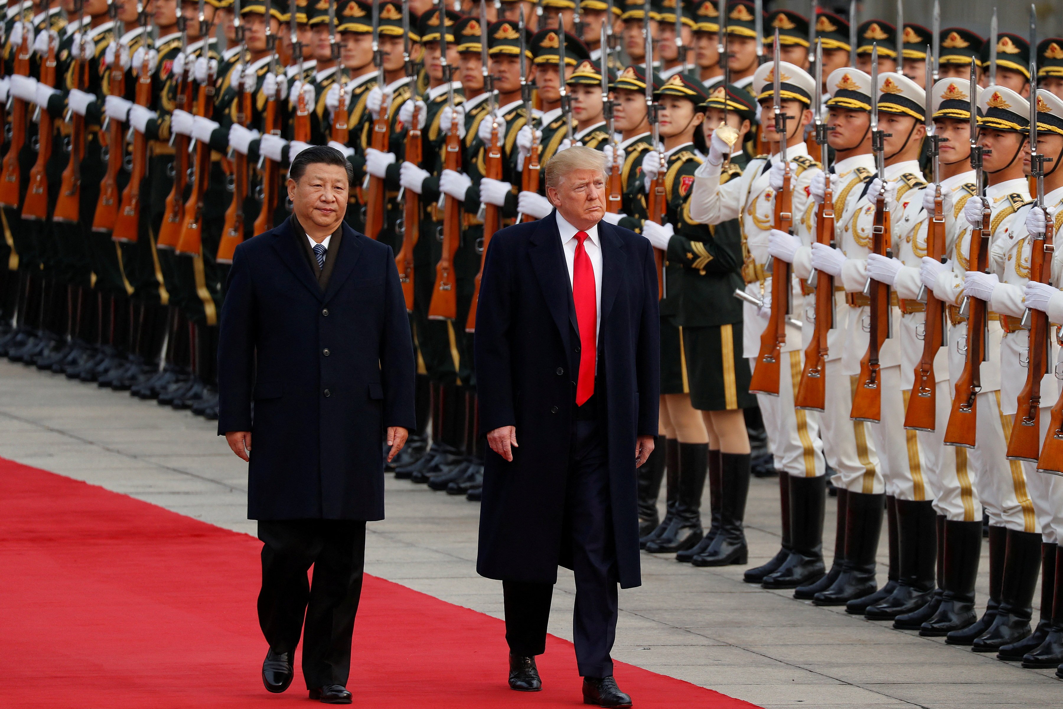 Donald Trump (right), then US president, takes part in a welcoming ceremony with Chinese President Xi Jinping in Beijing on November 9, 2017. Photo: Reuters