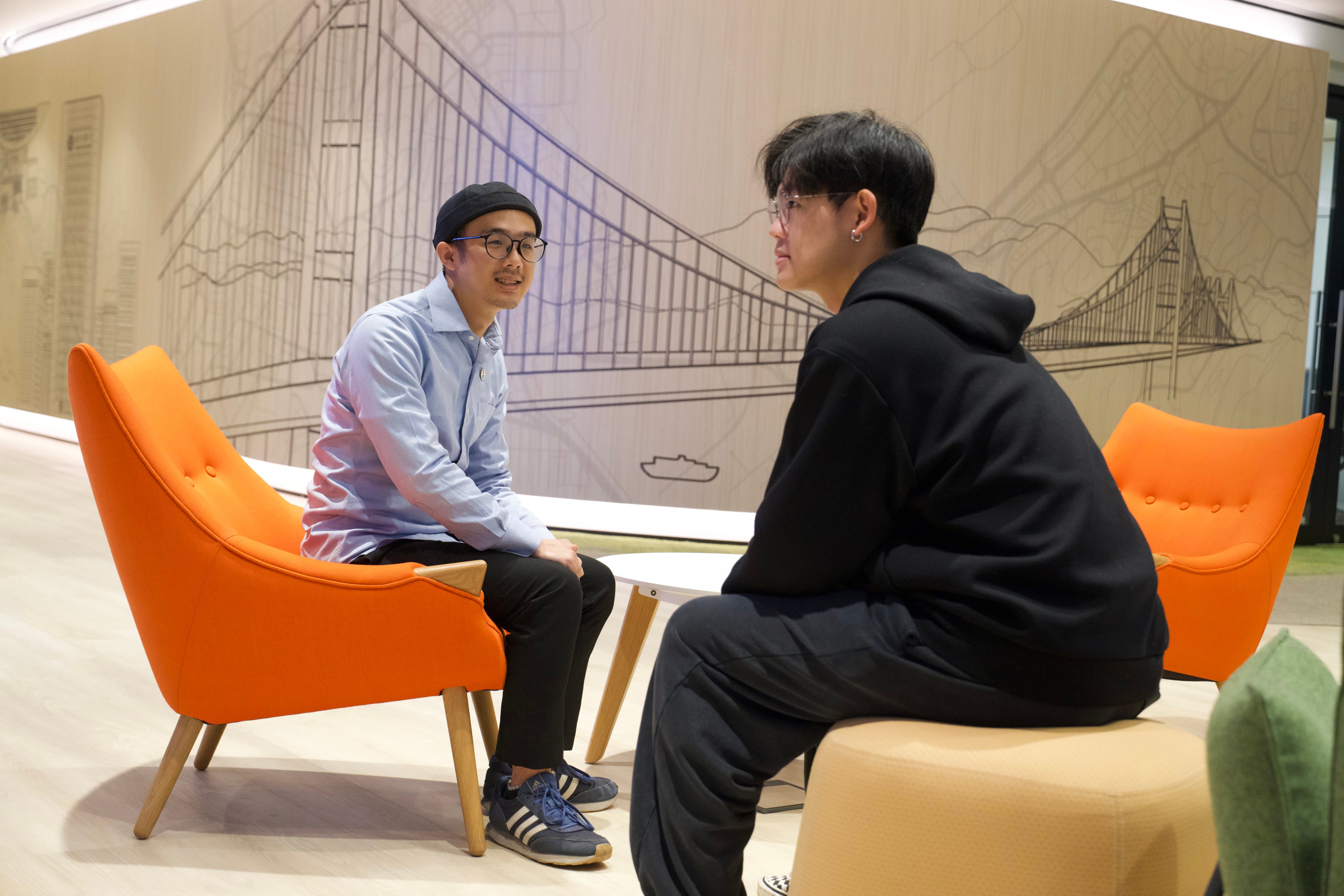 Johnny Law (left) and tattoo artist Nok attend a sharing session on the 10th anniversary of SideBySide’s youth career planning scheme. Photo: Sam Tsang