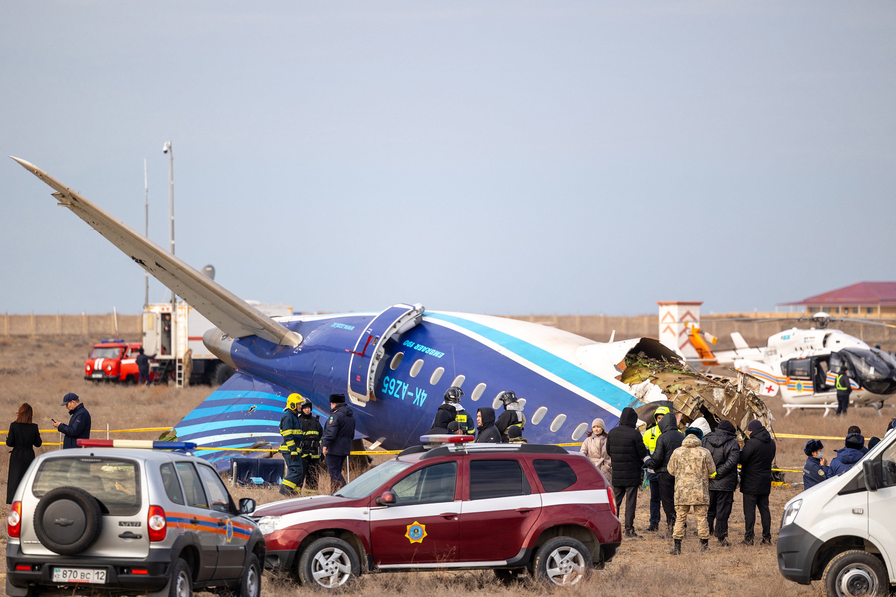 Emergency specialists work at the crash site of an Azerbaijan Airlines jet near the Kazakh city of Aktau on December 25. Photo: AFP/Getty Images/TNS
