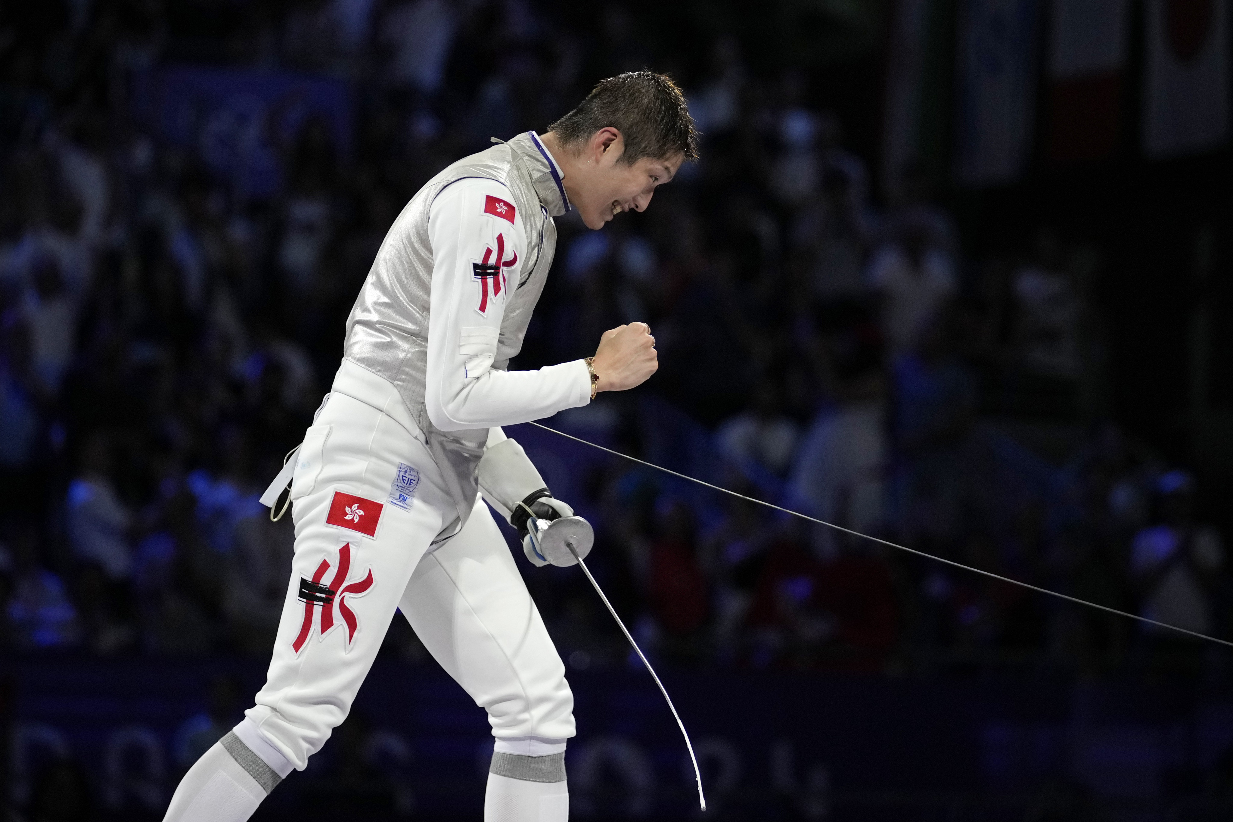 Hong Kong fencer Cheung Ka-long celebrates after winning gold in the men’s individual foil  in Paris. Photo: AP