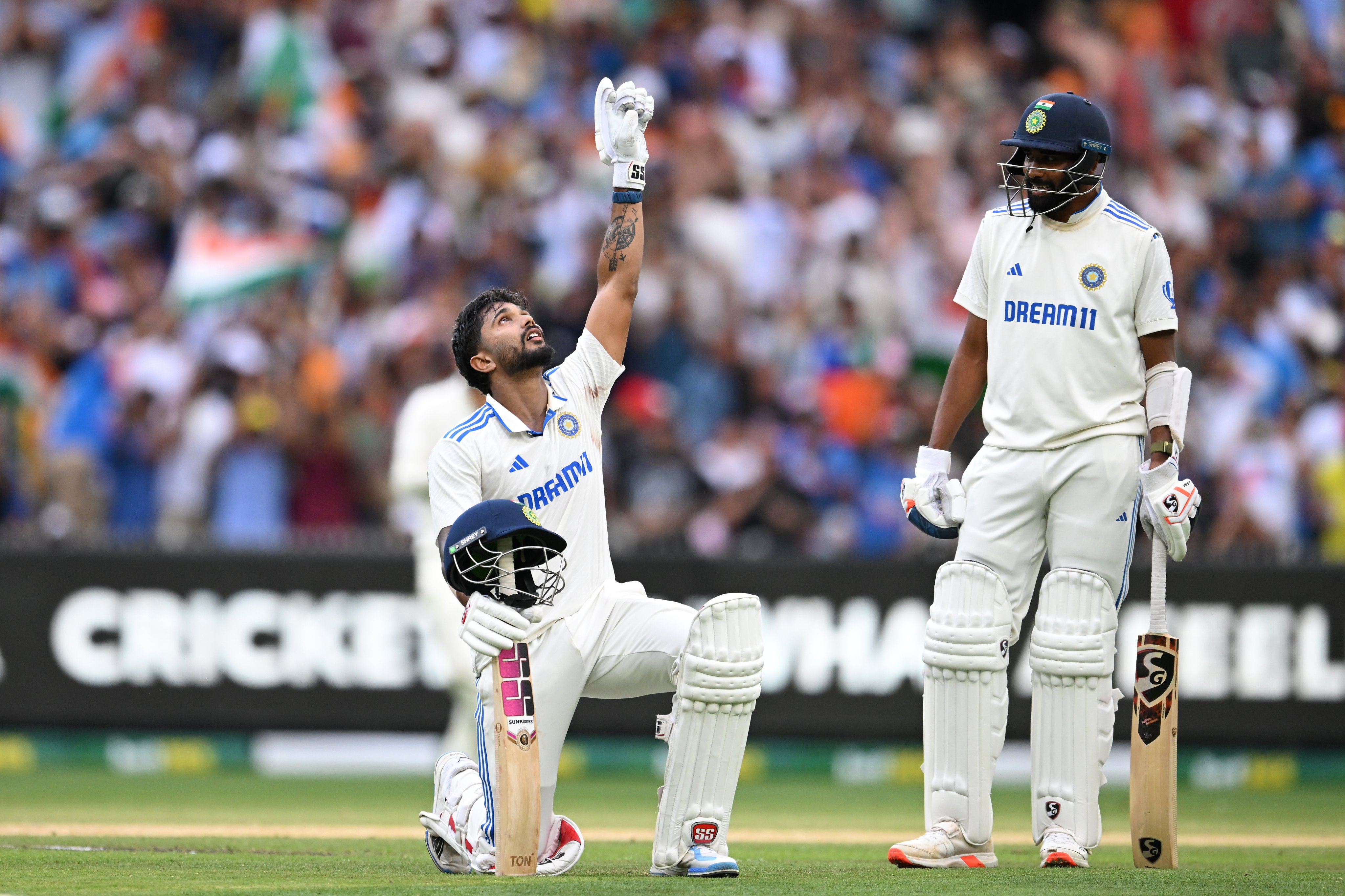 India’s Nitish Kumar Reddy (left) acknowledges the moment after making a century during day three of the fourth Test against Australia at the Melbourne Cricket Ground on Saturday. Photo: EPA-EFE