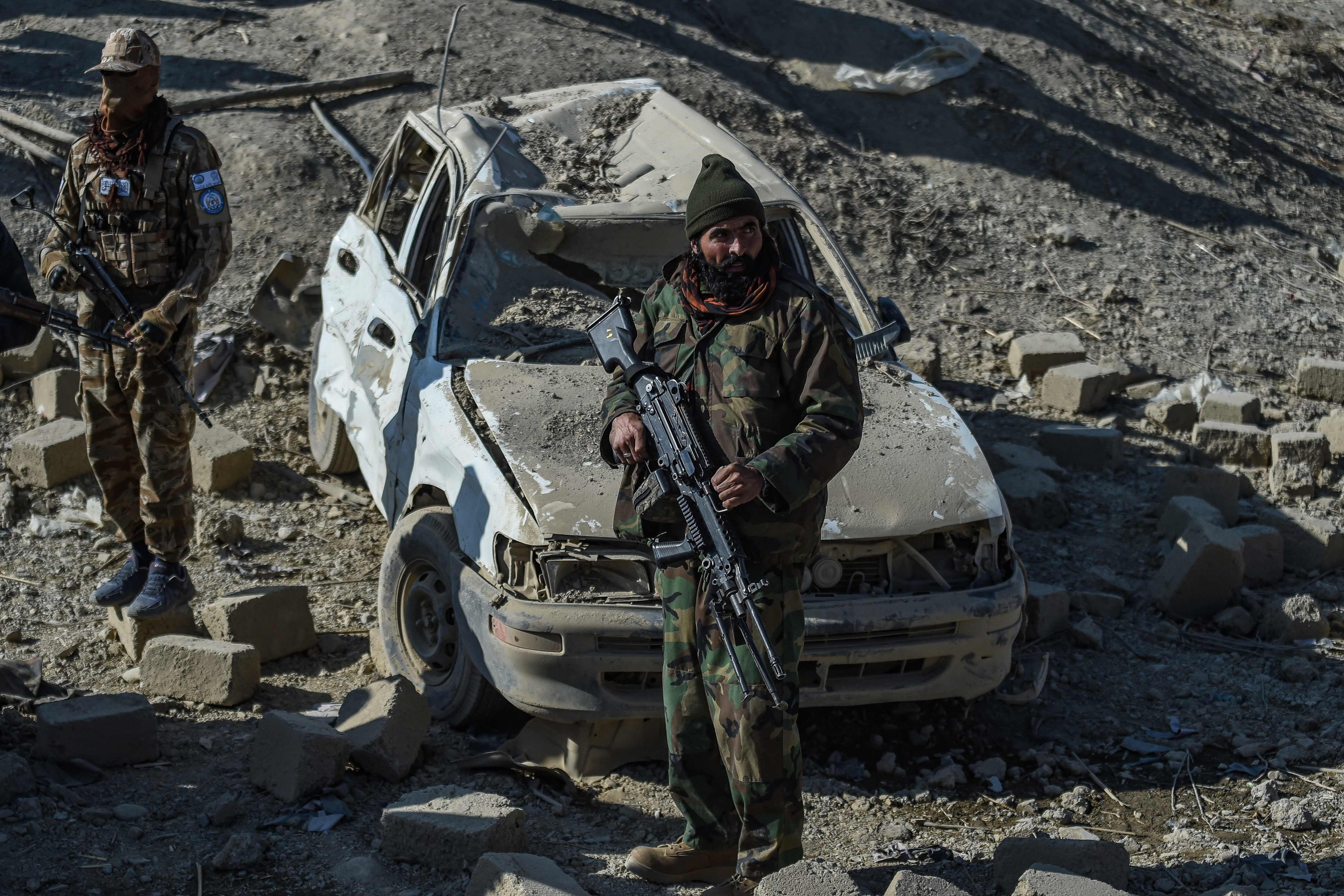 Taliban security personnel stand guard near the site of a Pakistani strike in Afghanistan’s Barmal district, eastern Paktika province. Photo: AFP