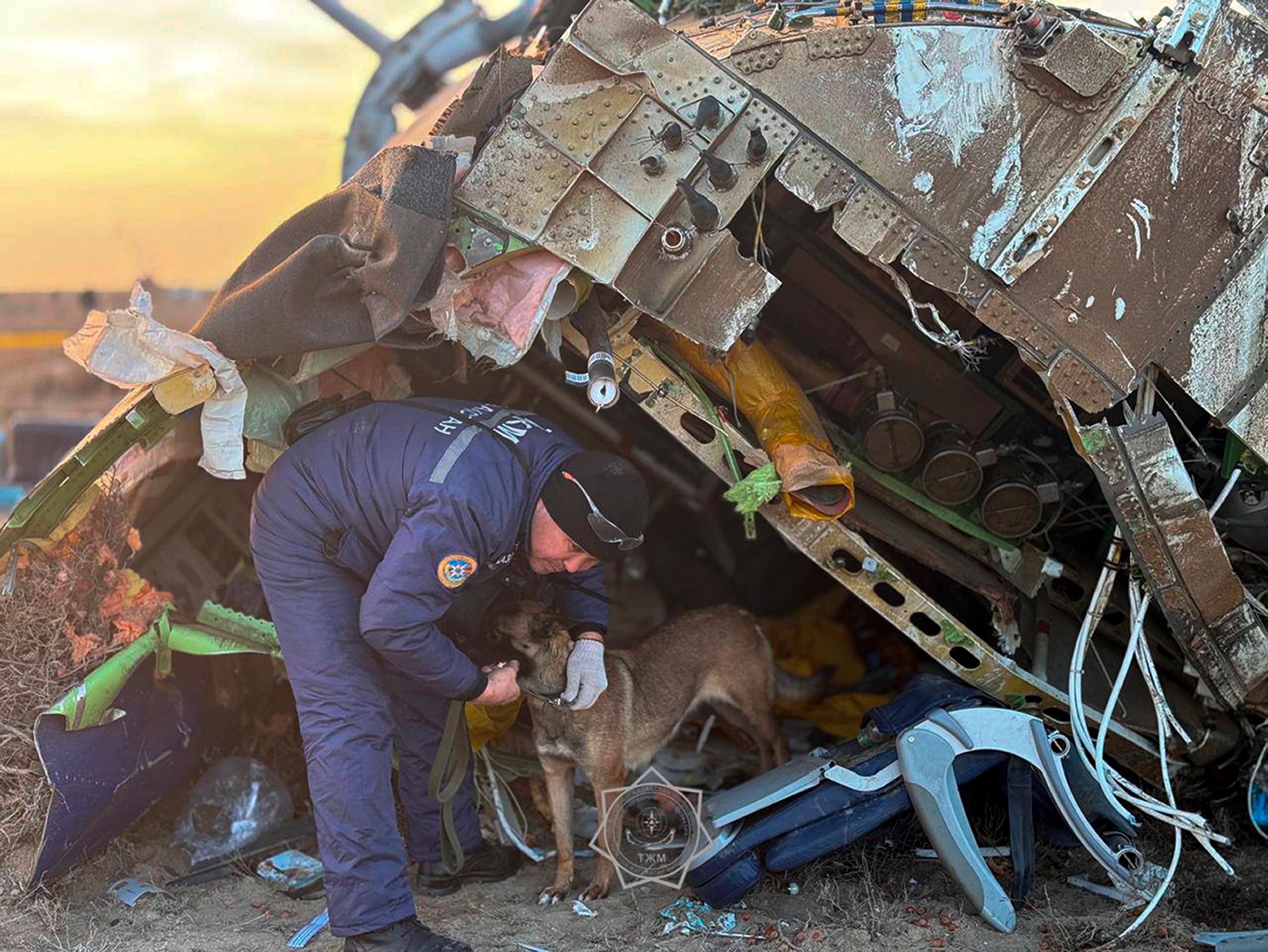 A rescuer searches at the wreckage of the crashed Azerbaijan Airlines plane in Aktau, Kazakhstan, on December 26. Photo: Kazakhstan’s Emergency Ministry Press Service via AP