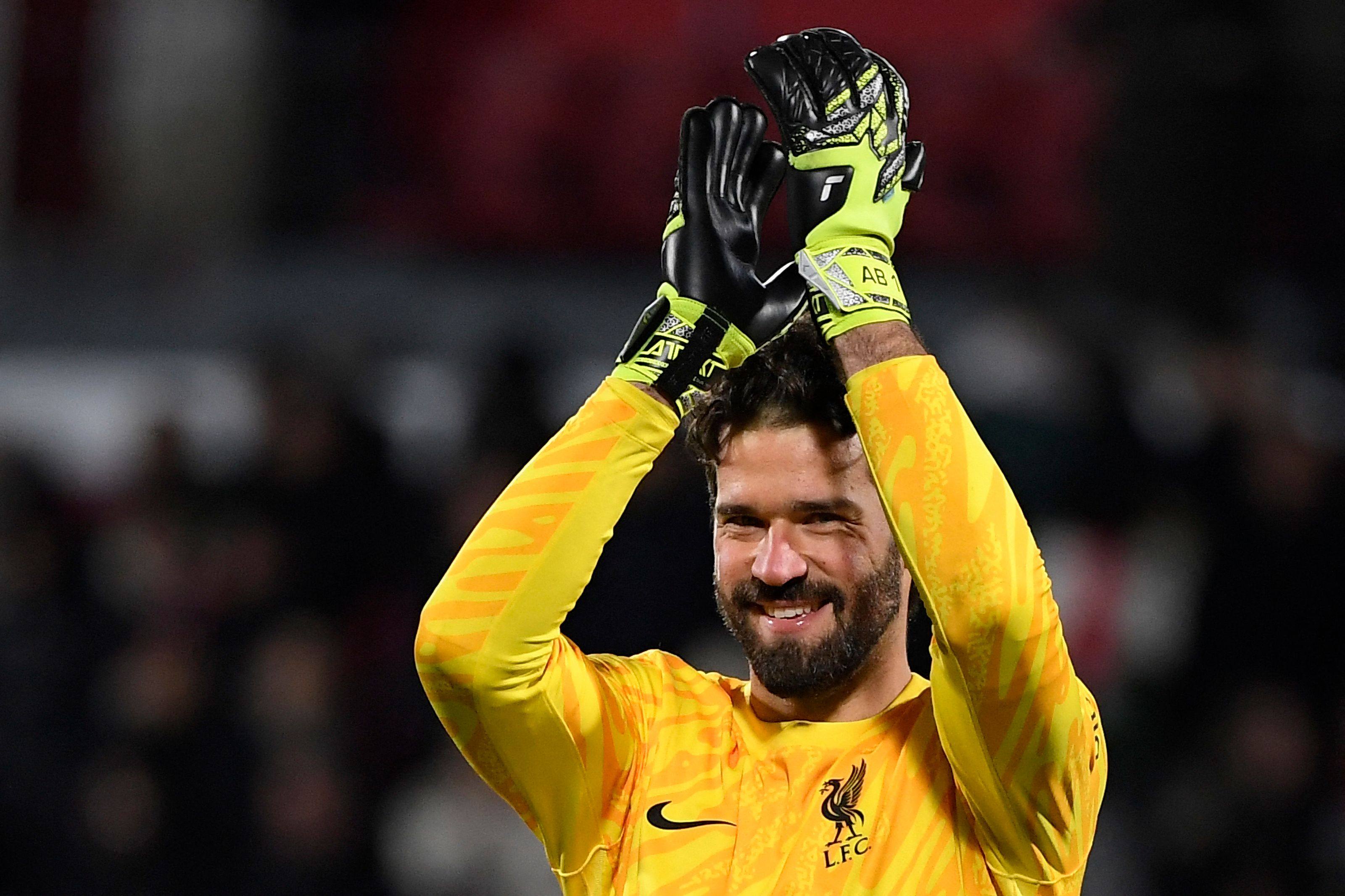 Liverpool goalkeeper Alisson Becker is looking to celebrate a second Premier League title in six seasons. Photo: AFP