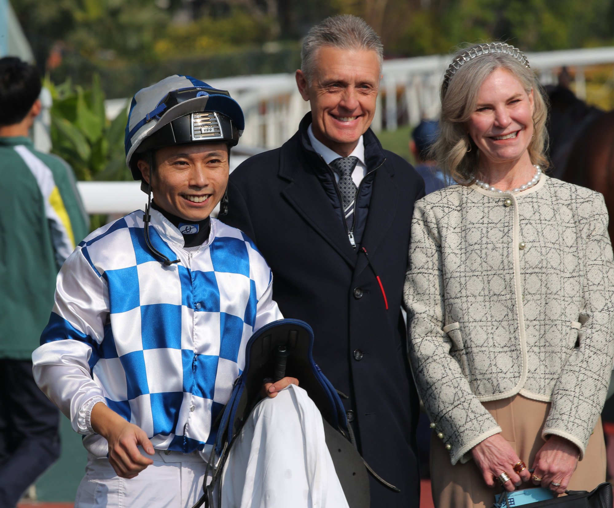 Jockey Matthew Poon, Mark Newnham and his wife Donna after Bravehearts’ win at Sha Tin.