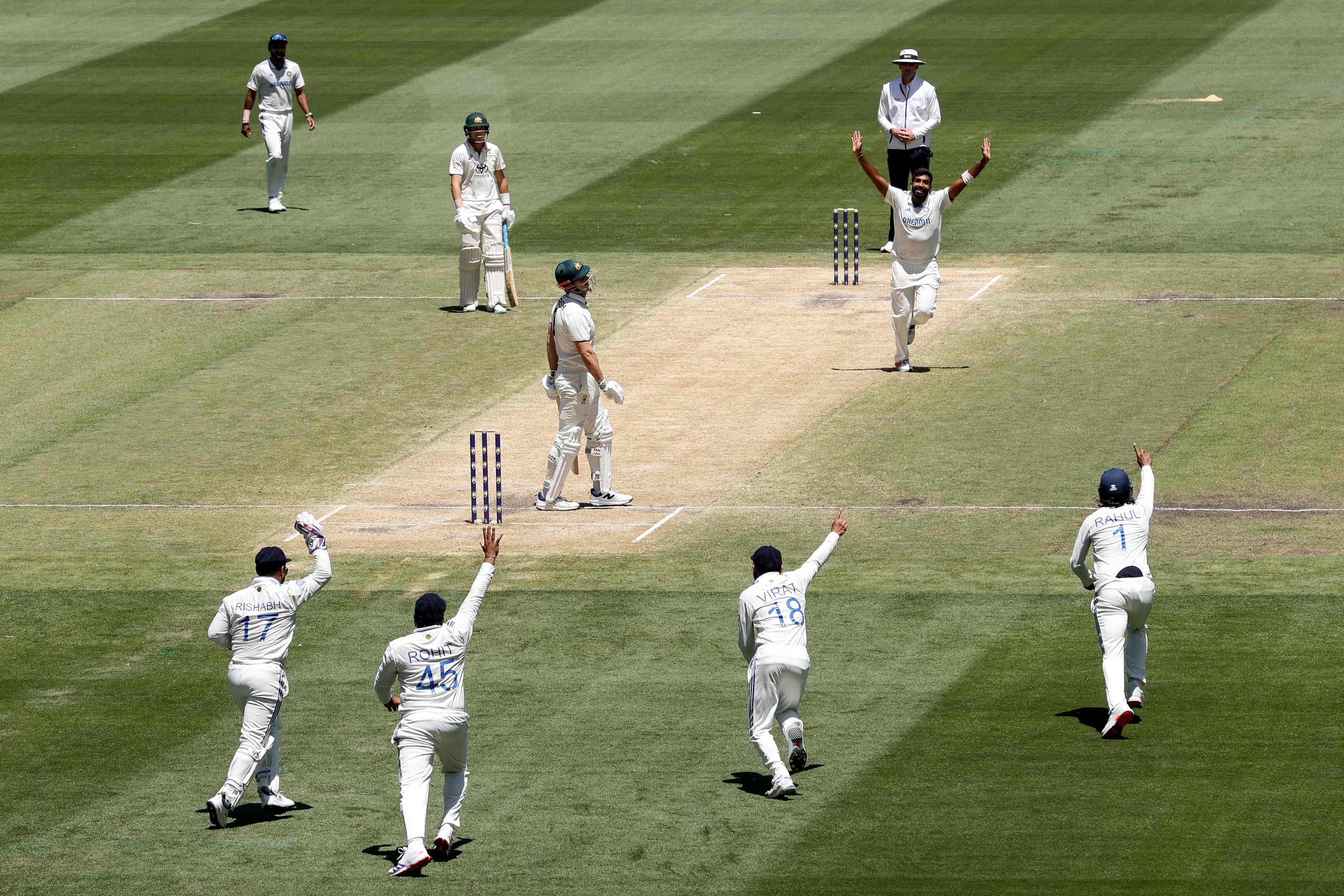 India’s Jasprit Bumrah (second from right) celebrates with teammates the wicket of Australia’s Mitchell Marsh (centre) on day four of the fourth Test at the MCG on Sunday. Photo: AFP