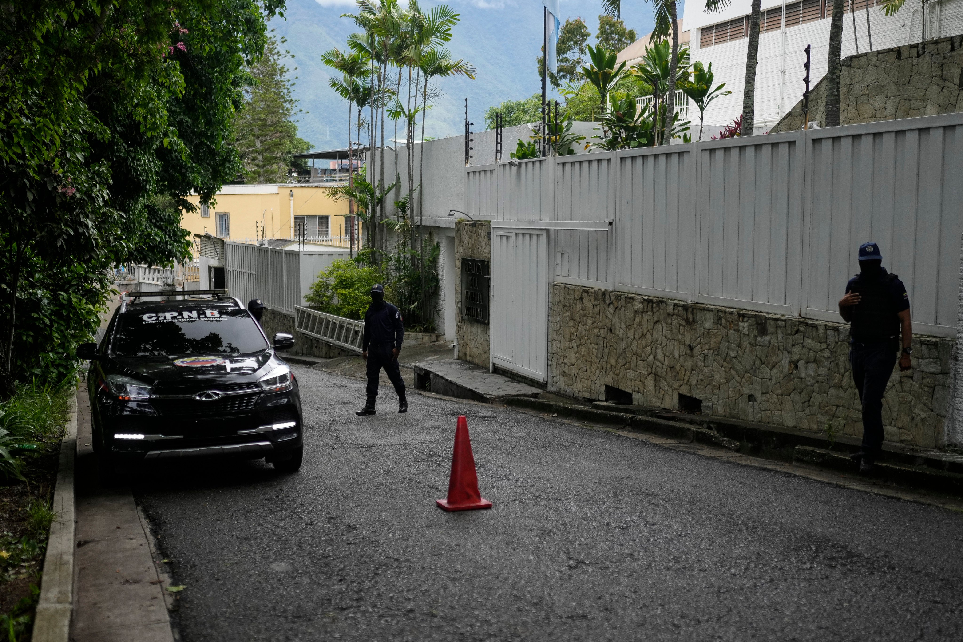 A police patrol car sits parked outside Argentina’s embassy where some members of Venezuela’s opposition are seeking asylum inside, in Caracas, Venezuela. Photo: AP