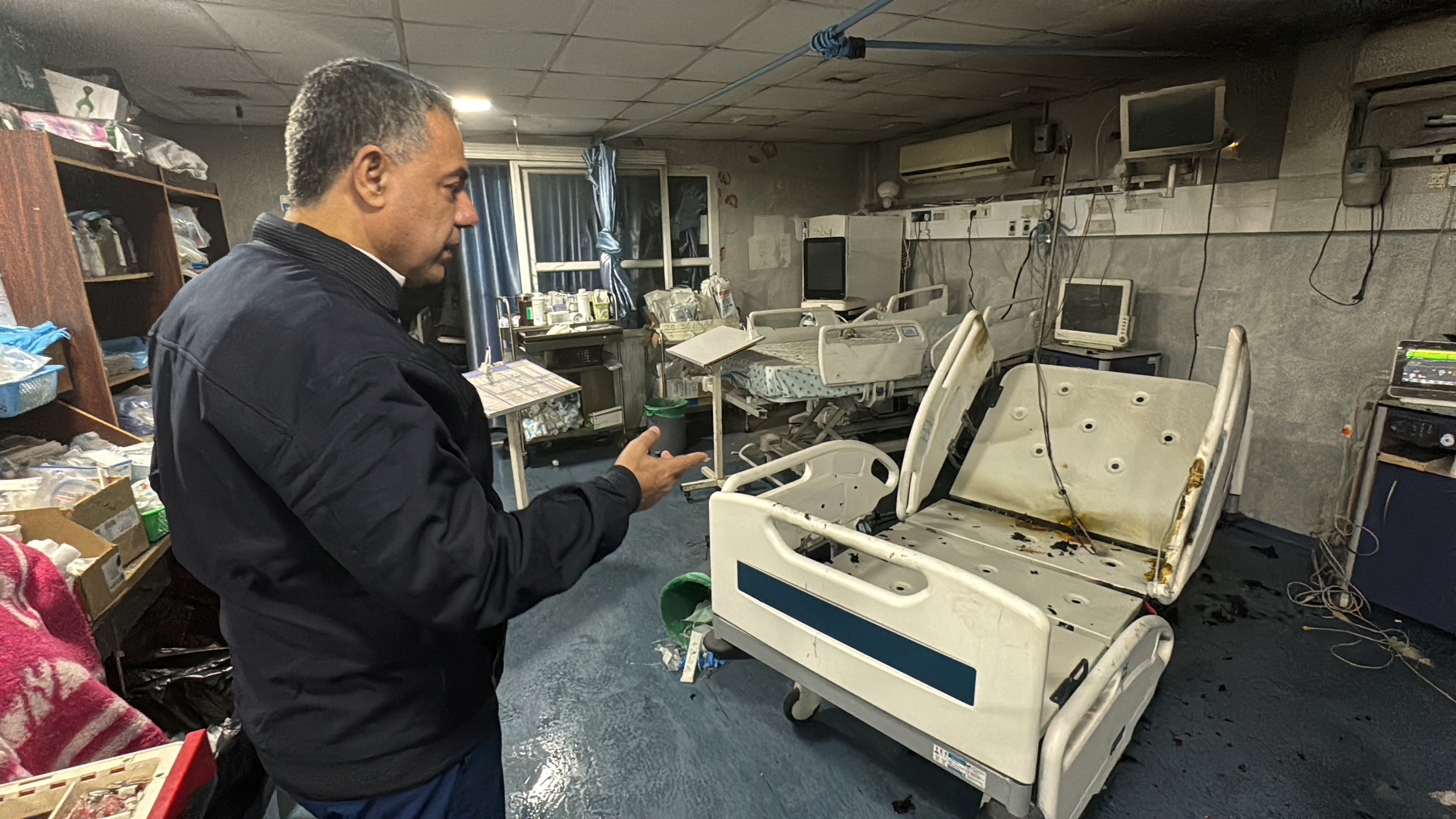 Dr Hussam Abu Safiya, director of Kamal Adwan hospital, shows the damage inside the hospital in Beit Lahiya, northern Gaza on December 18. On Saturday, Gaza’s health ministry said Abu Safiya had been arrested by Israeli soldiers on Friday. Photo: Reuters