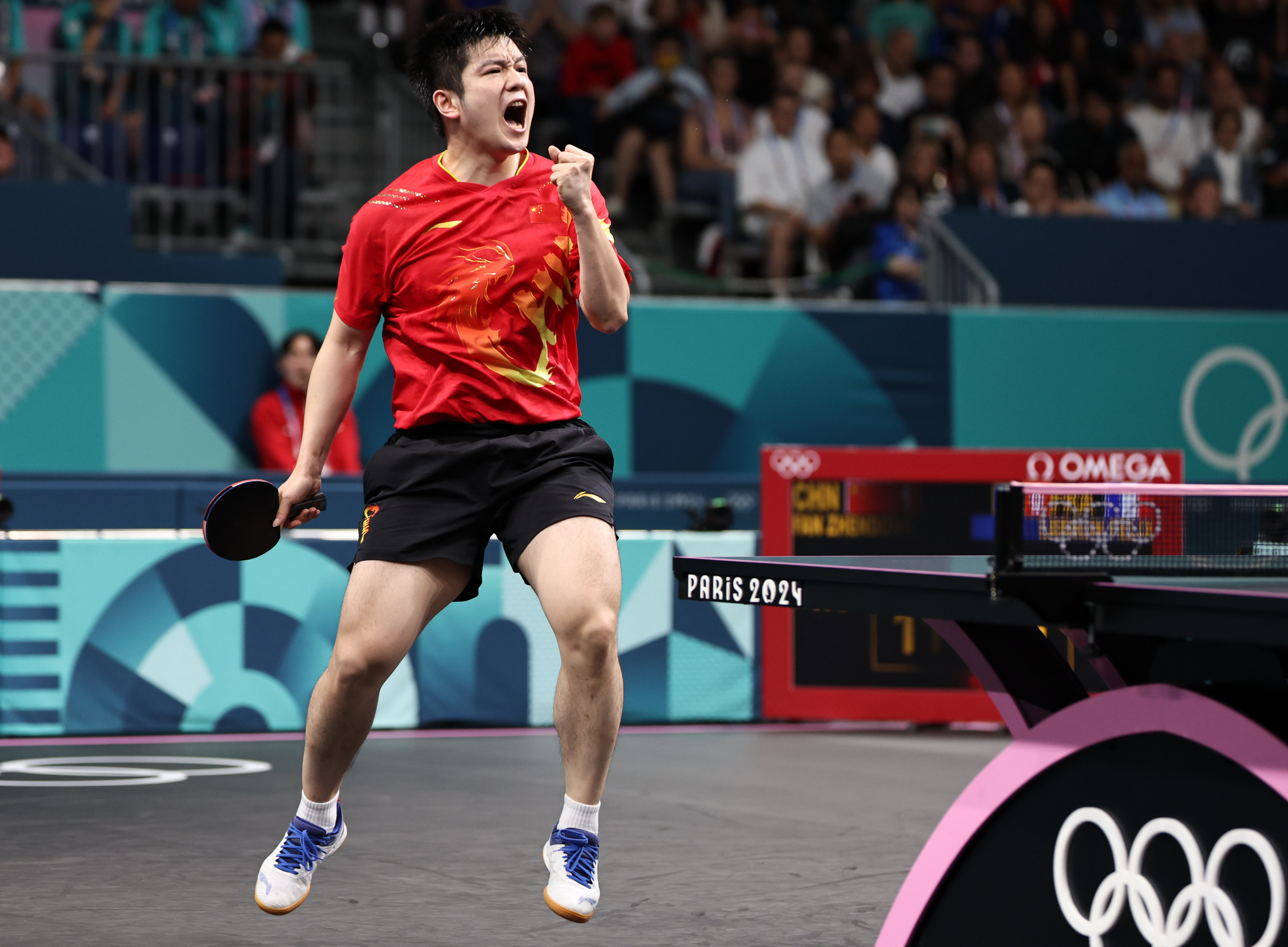 Fan Zhendong celebrates winning a point during China’s 2024 Olympic men’s team semi-final victory over France. Photo: Xinhua