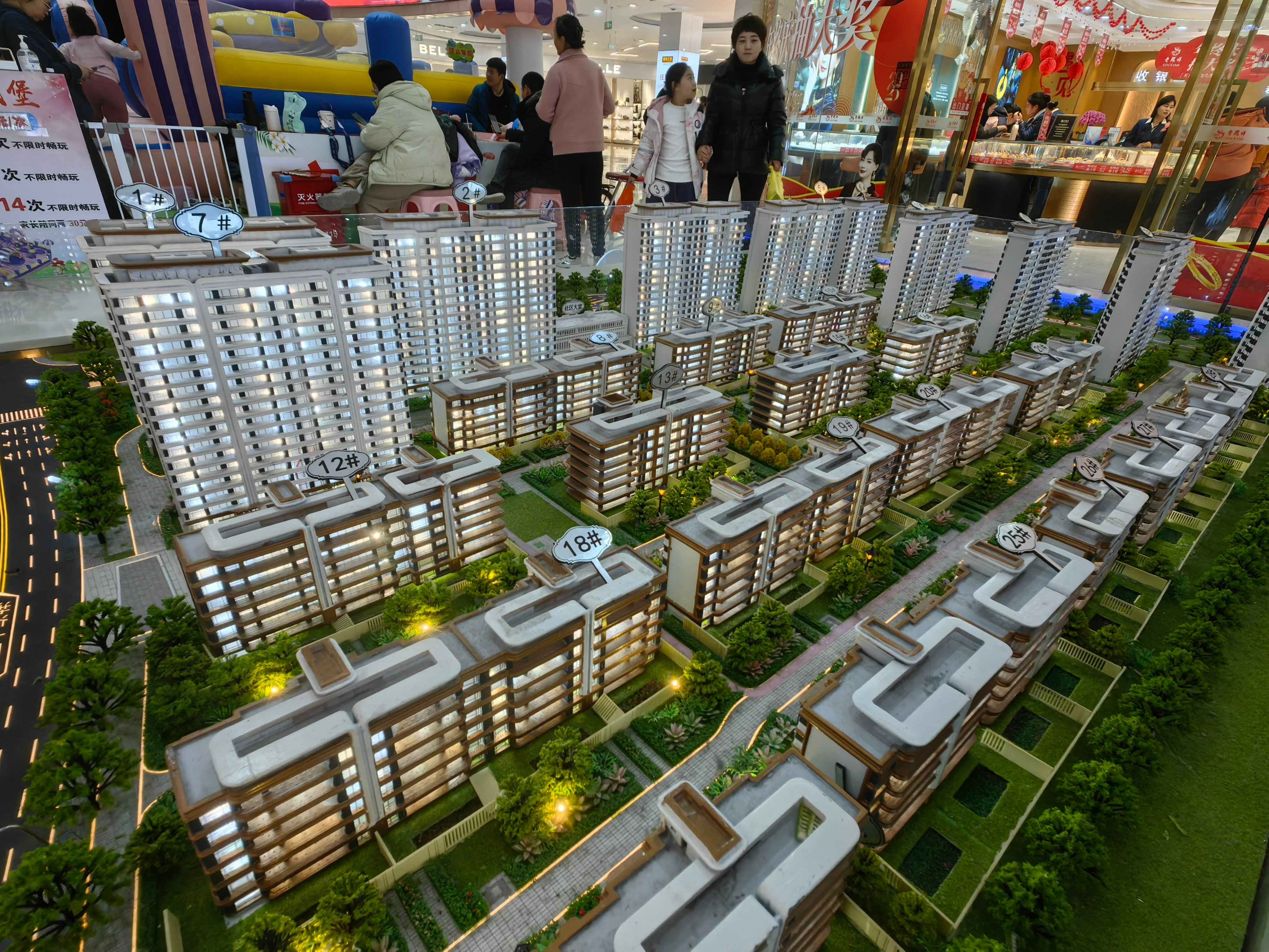 Prospective buyers at a property booth inside a shopping mall in Binzhou, China on December 22, 2024. Photo: Getty Images