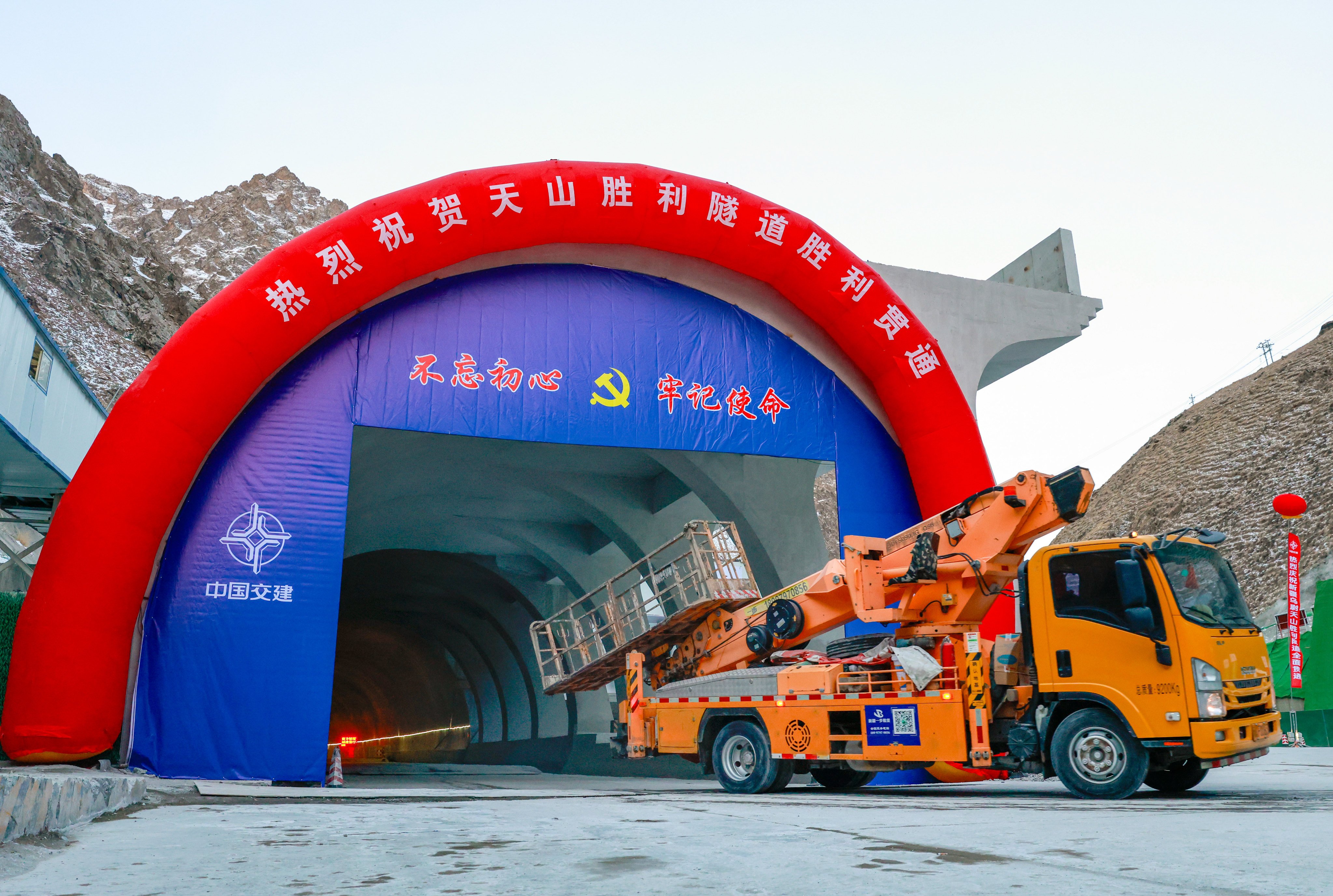 Workers drive a construction vehicle out of the Tianshan Shengli Tunnel on Monday. Photo: Xinhua