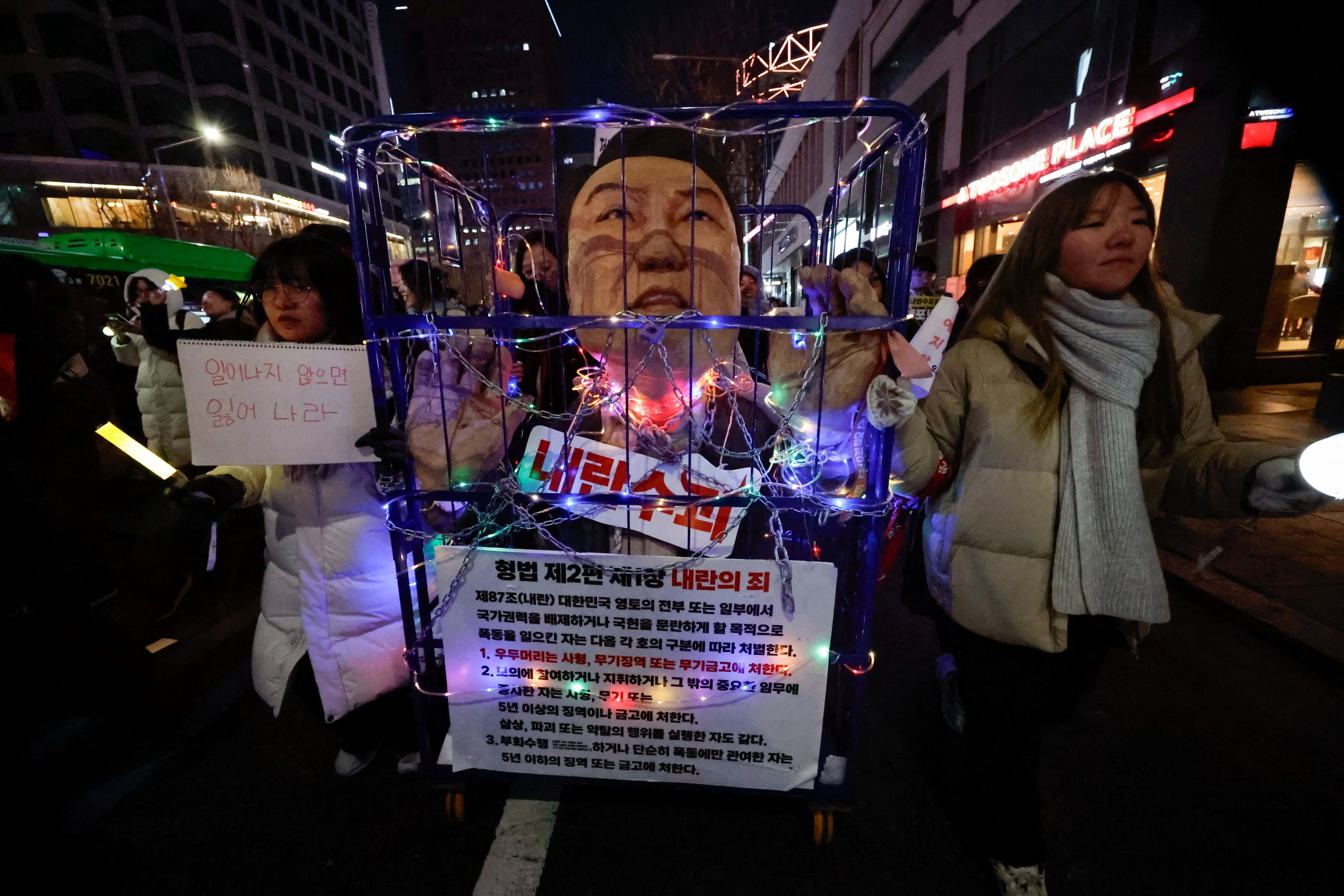 Protesters drag a figure depicting South Korea’s impeached President Yoon Suk-yeol during a rally in Seoul on December 28. Photo: Reuters