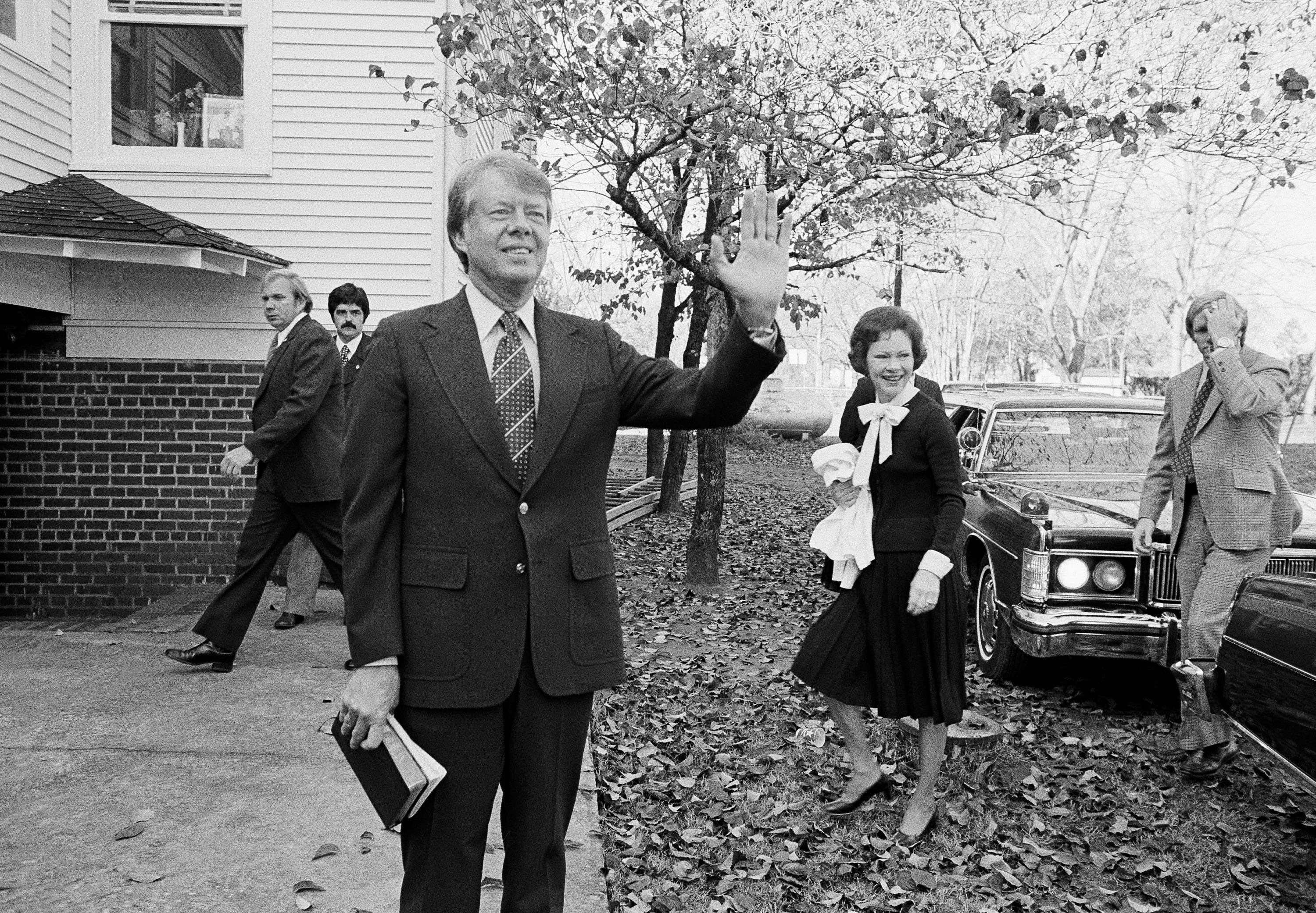 Then-president-elect Jimmy Carter waves to the crowd as he and his wife Rosalynn arrive at the Plains Baptist Church to attend services in Plains, Georgia, in November 1976. Photo: AP