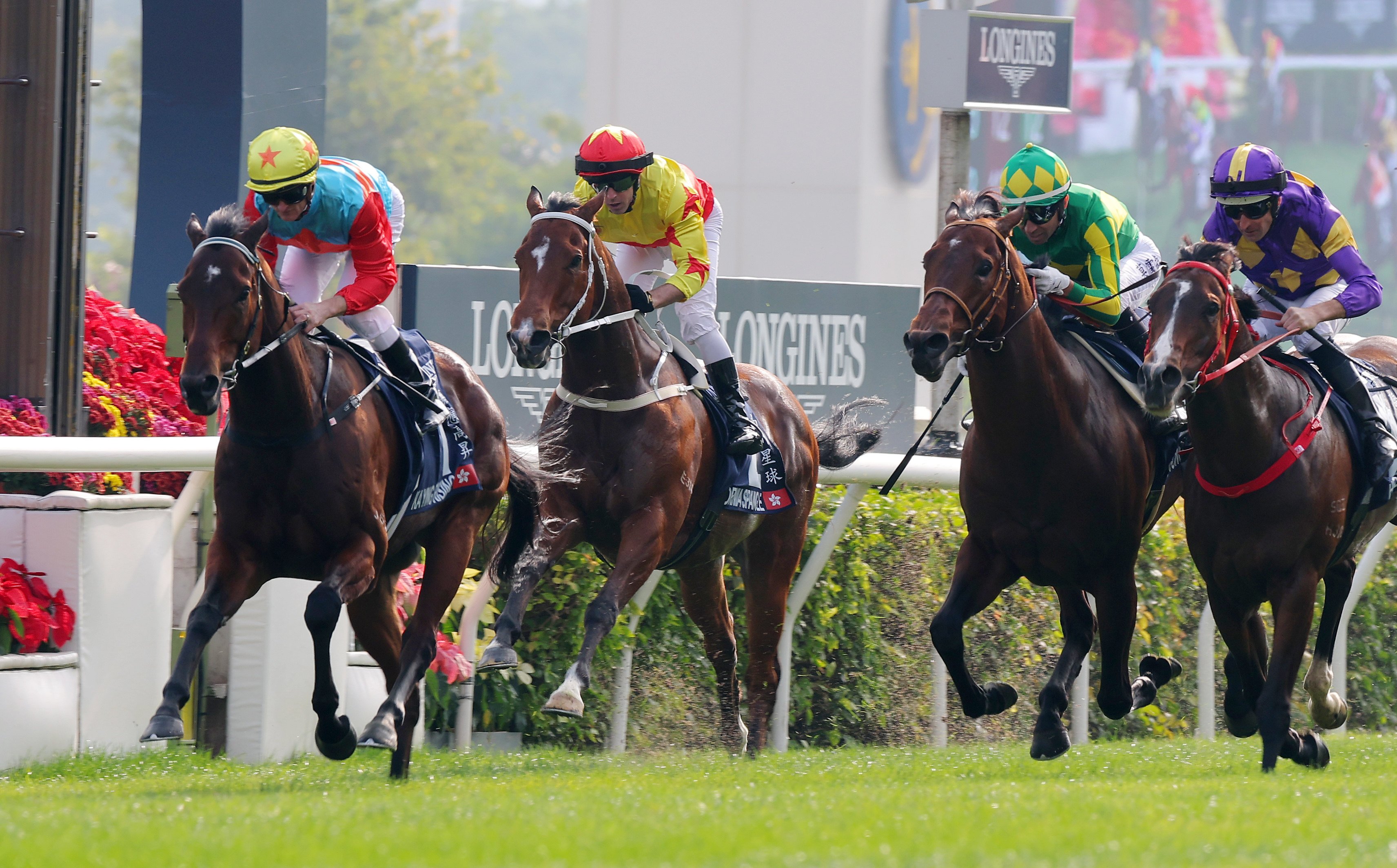 Ka Ying Rising (left) collects his breakthrough Group One win at Sha Tin. Photos: Kenneth Chan