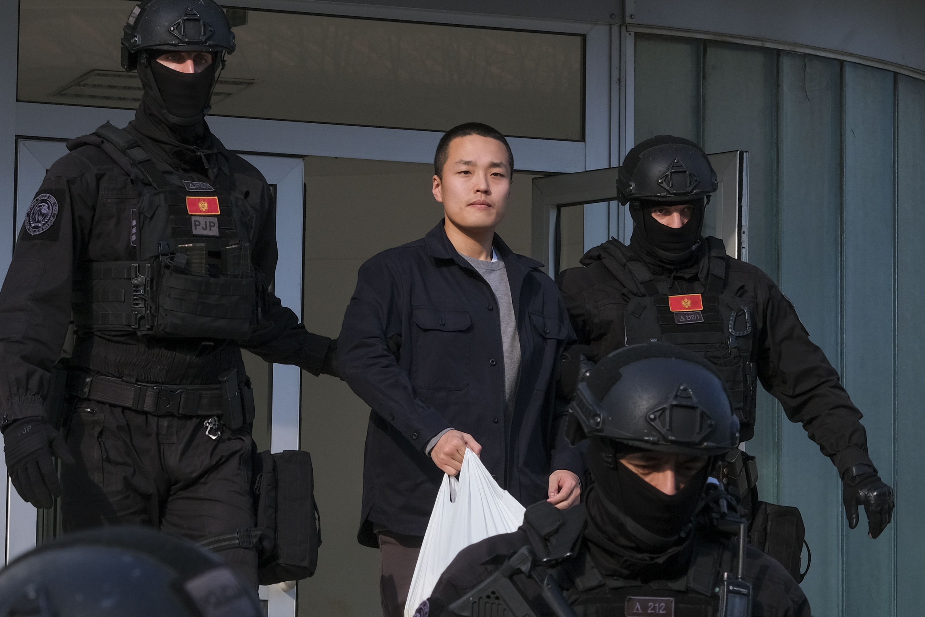 Montenegrin police officers escort South Korean citizen, Terraform Labs founder Do Kwon in Montenegro’s capital Podgorica on March 23. Photo: AP