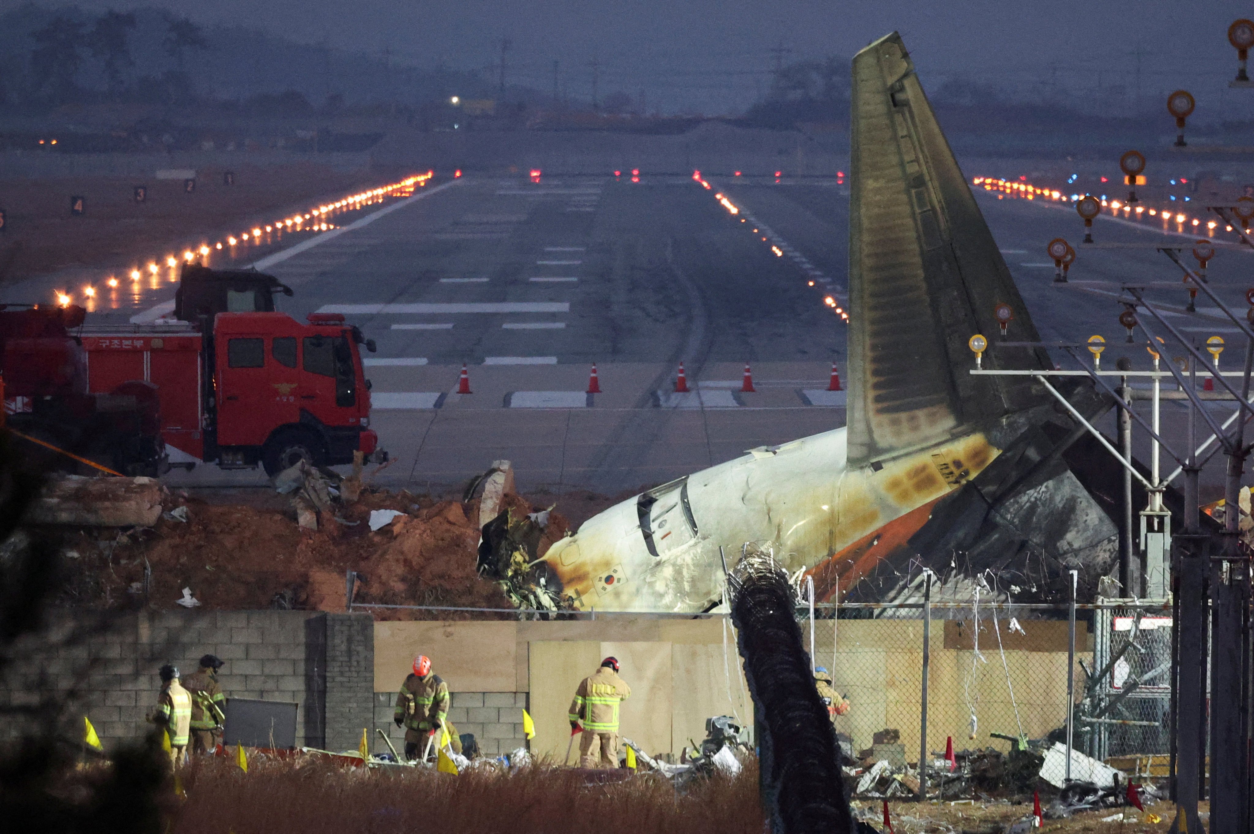 Rescuers work near the wreckage of the Jeju Air aircraft that went off the runway and crashed at Muan International Airport in South Korea on December 30. Photo: Reuters