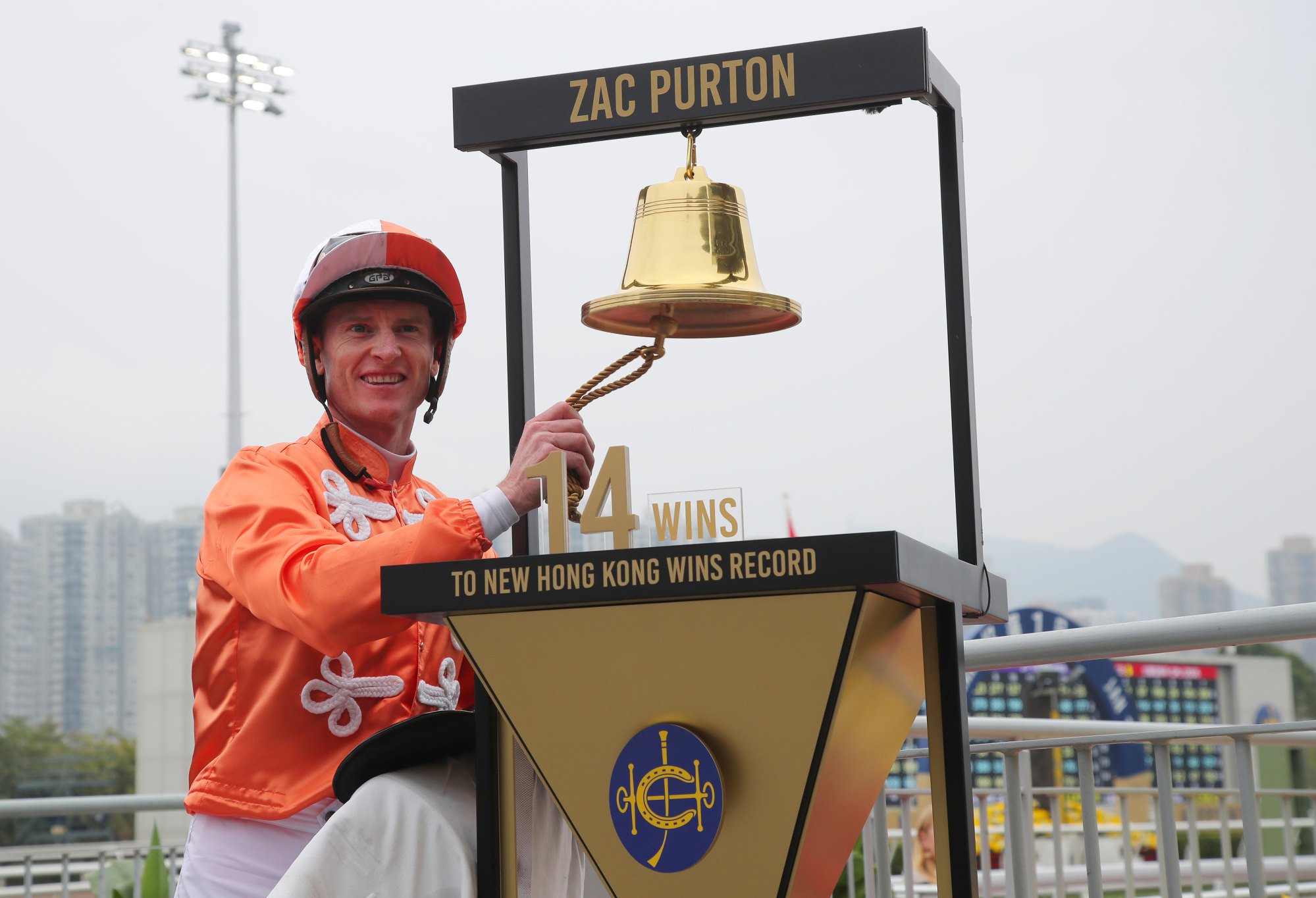 Zac Purton rings the bell which counts down to Douglas Whyte’s record of 1,813 wins in Hong Kong.