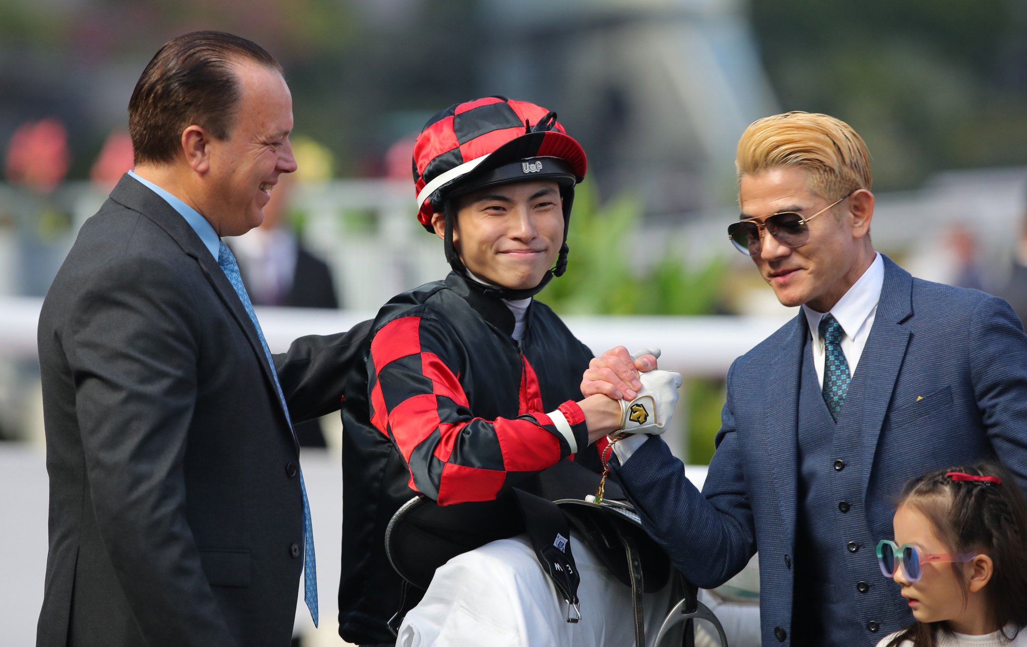 Trainer Caspar Fownes, jockey Ellis Wong Chi-wang and owner Aaron Kwok Fu-shing after Dancing Code’s victory.