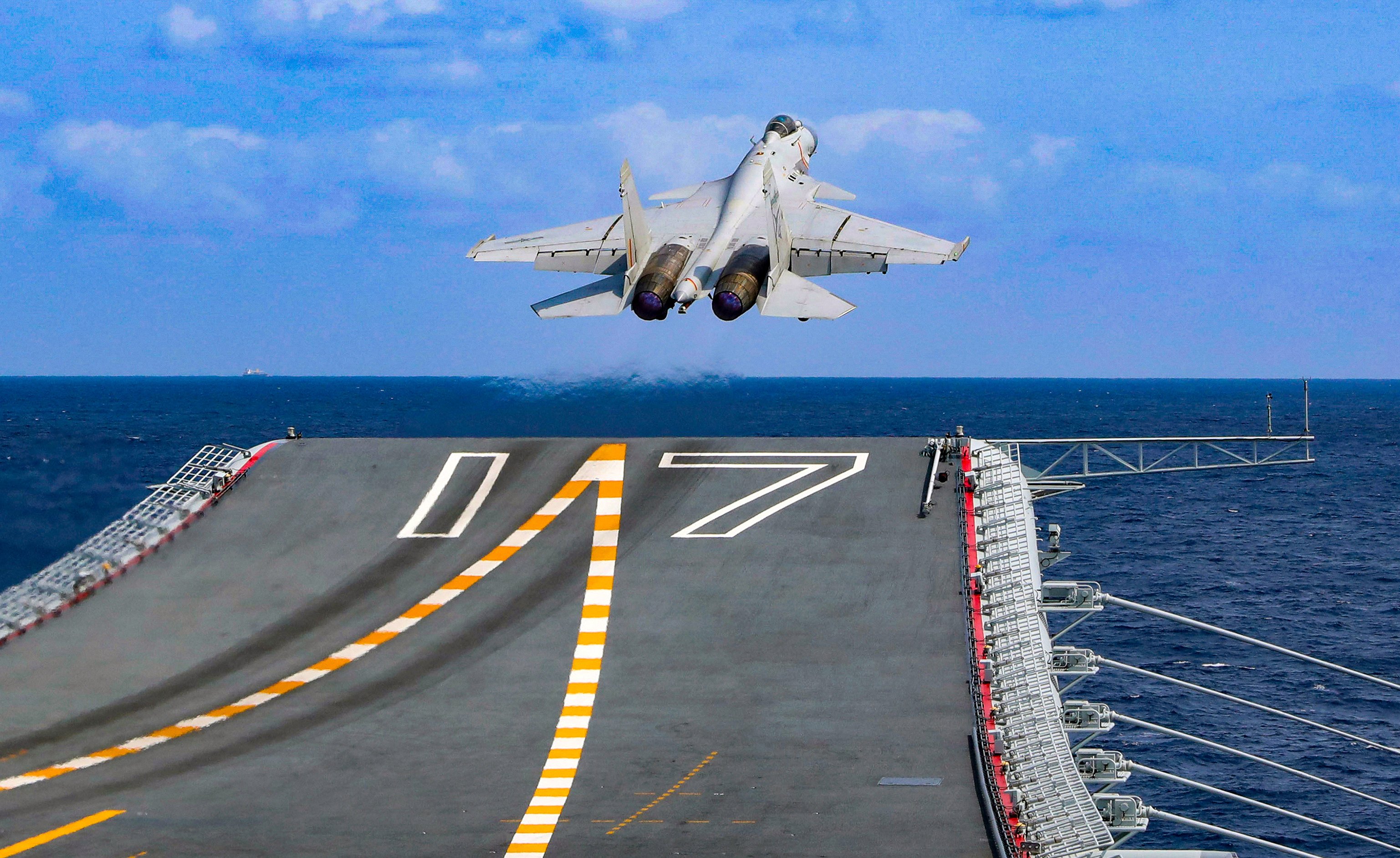 A PLA fighter jet takes off from the Shandong aircraft carrier during combat readiness patrol and military exercises in April 2023. Photo: Xinhua via AP