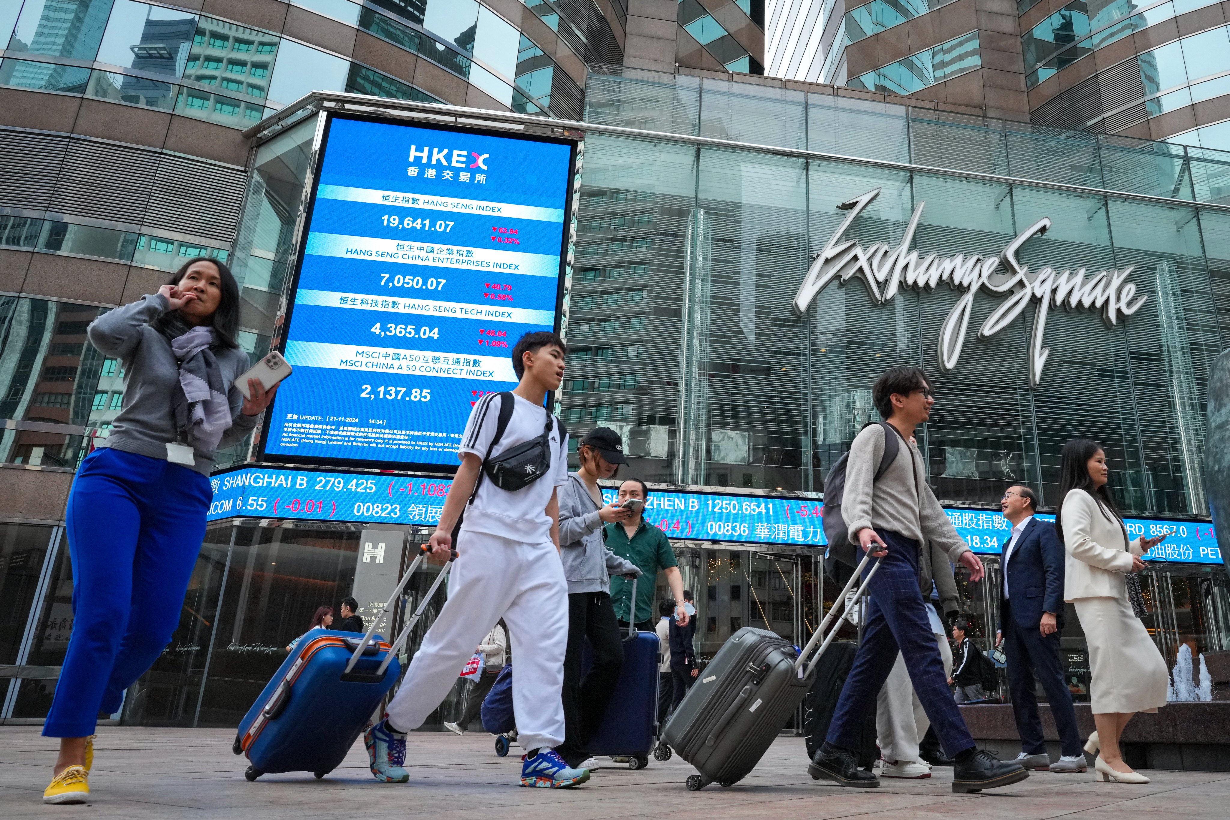 People walk outside Exchange Square in Central, home to bourse operator Hong Kong Exchanges and Clearing, on November 21, 2024. Photo: May Tse