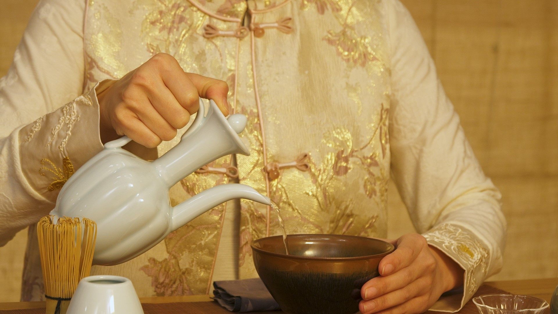 Hot water is gently poured into the tea bowl before whisking begins. Photo: Kayla Chan