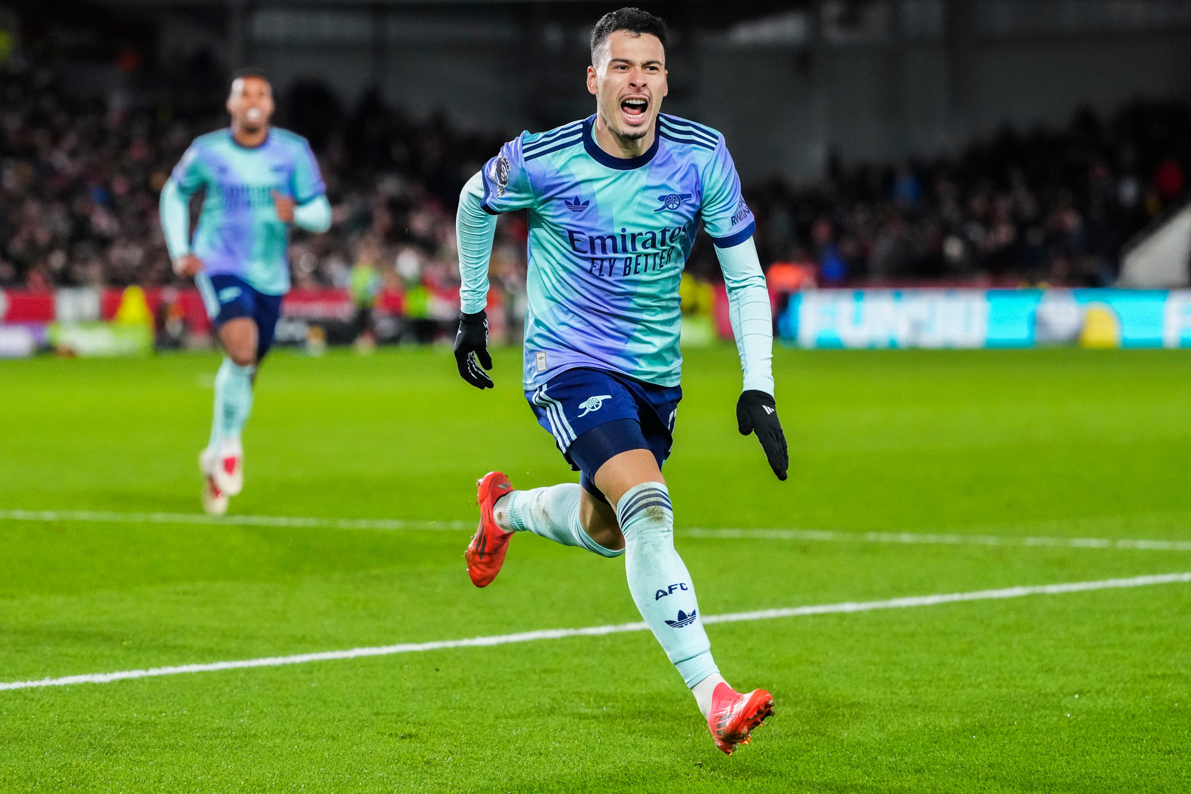 Arsenal’s Gabriel Martinelli celebrates after scoring his side’s third against Brentford at the Gtech Community Stadium. Photo: AP