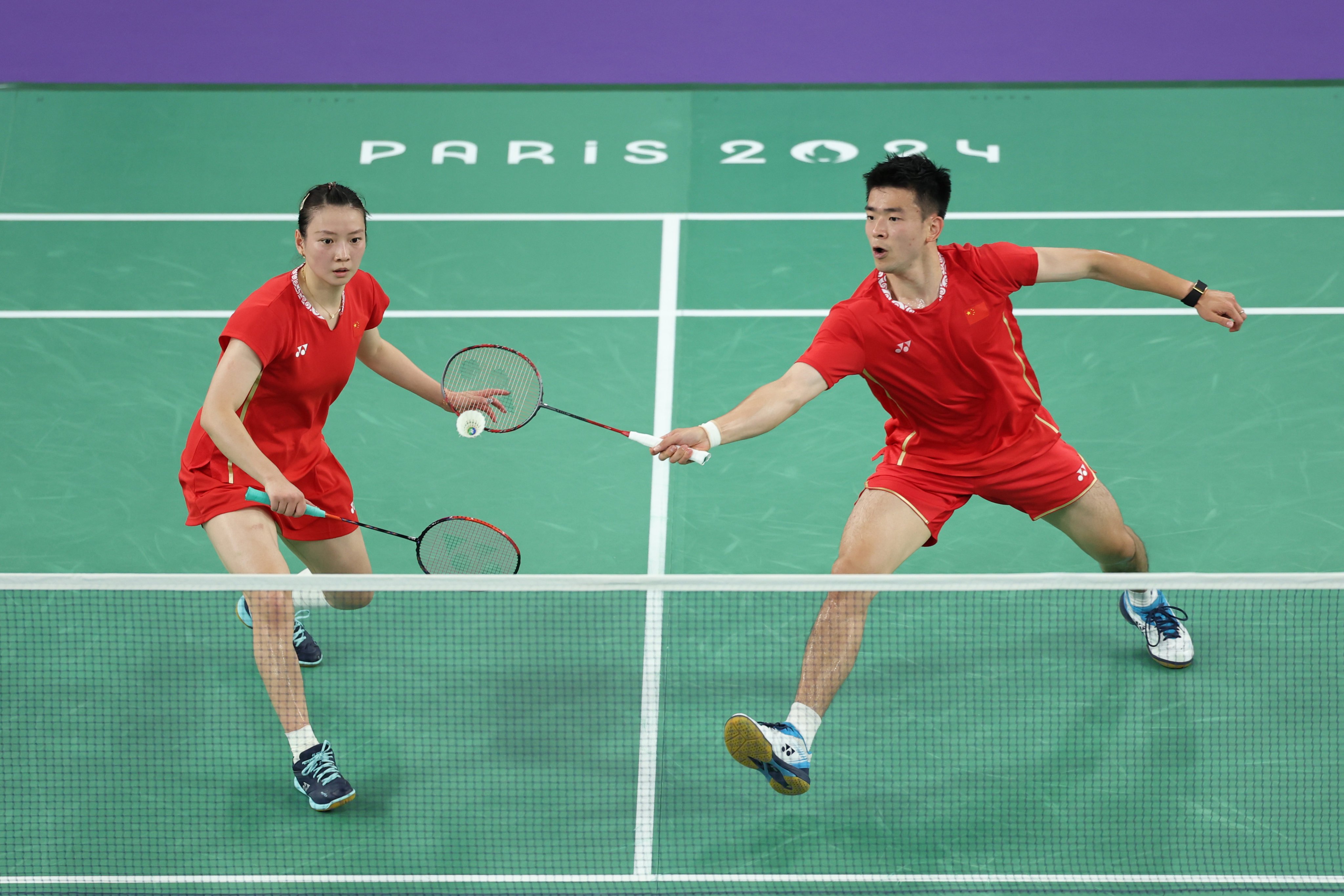 Huang Yaqiong (left) and Zheng Siwei on their way to winning mixed doubles gold at the Paris Olympics. Photo: Xinhua