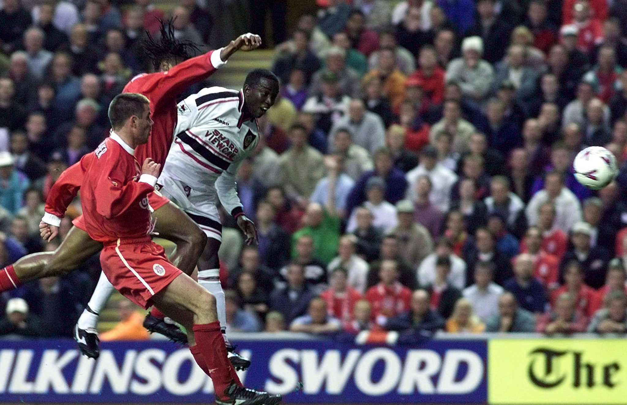 Manchester United striker Dwight Yorke (right) scores against Liverpool in May 1999. Photo: Reuters