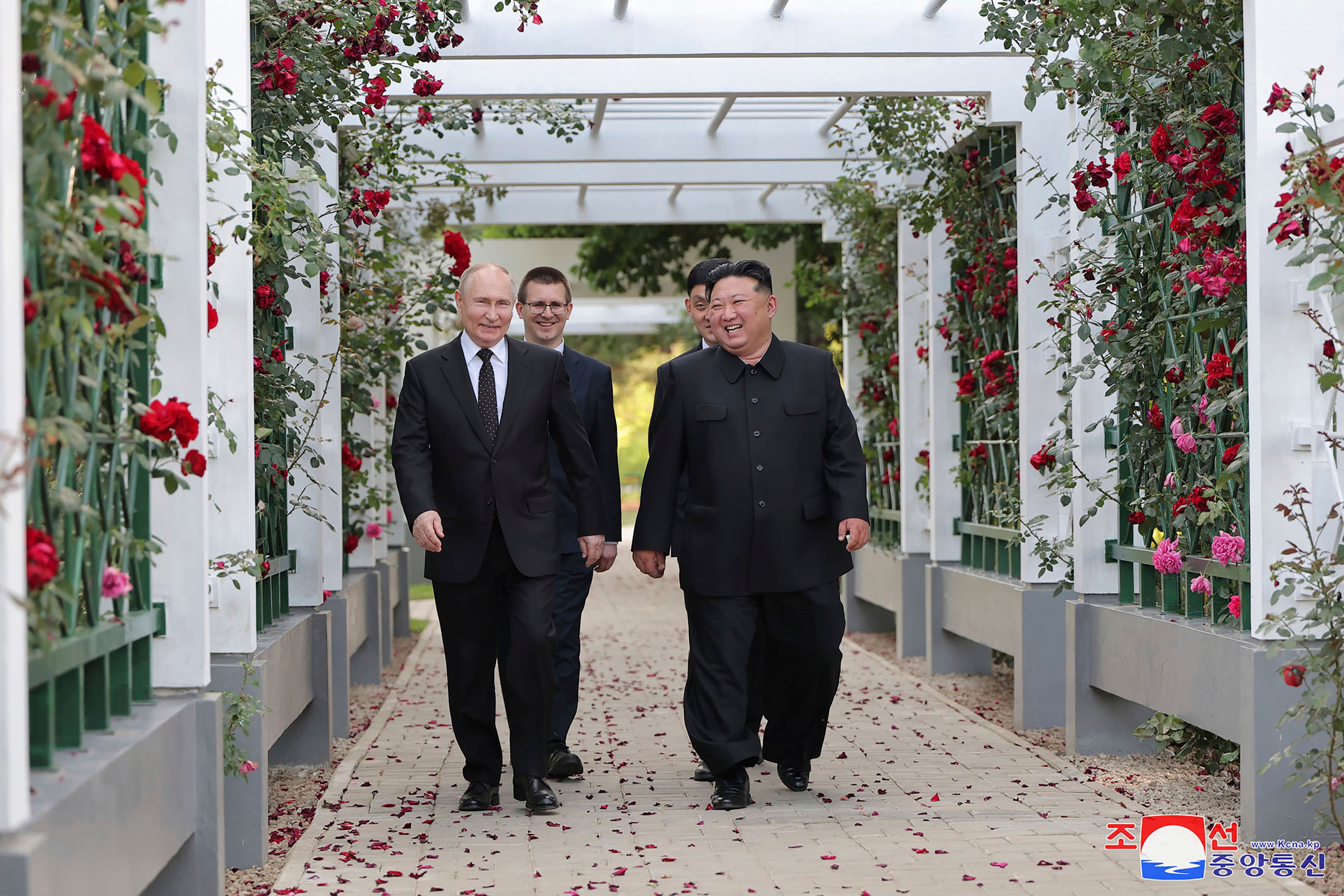 North Korean leader Kim Jong-un (right) and Russia’s President Vladimir Putin, walk through a garden of the Kumsusan State Guest House in Pyongyang, North Korea on June 19, 2024. Photo: KCNA/KNS via AP