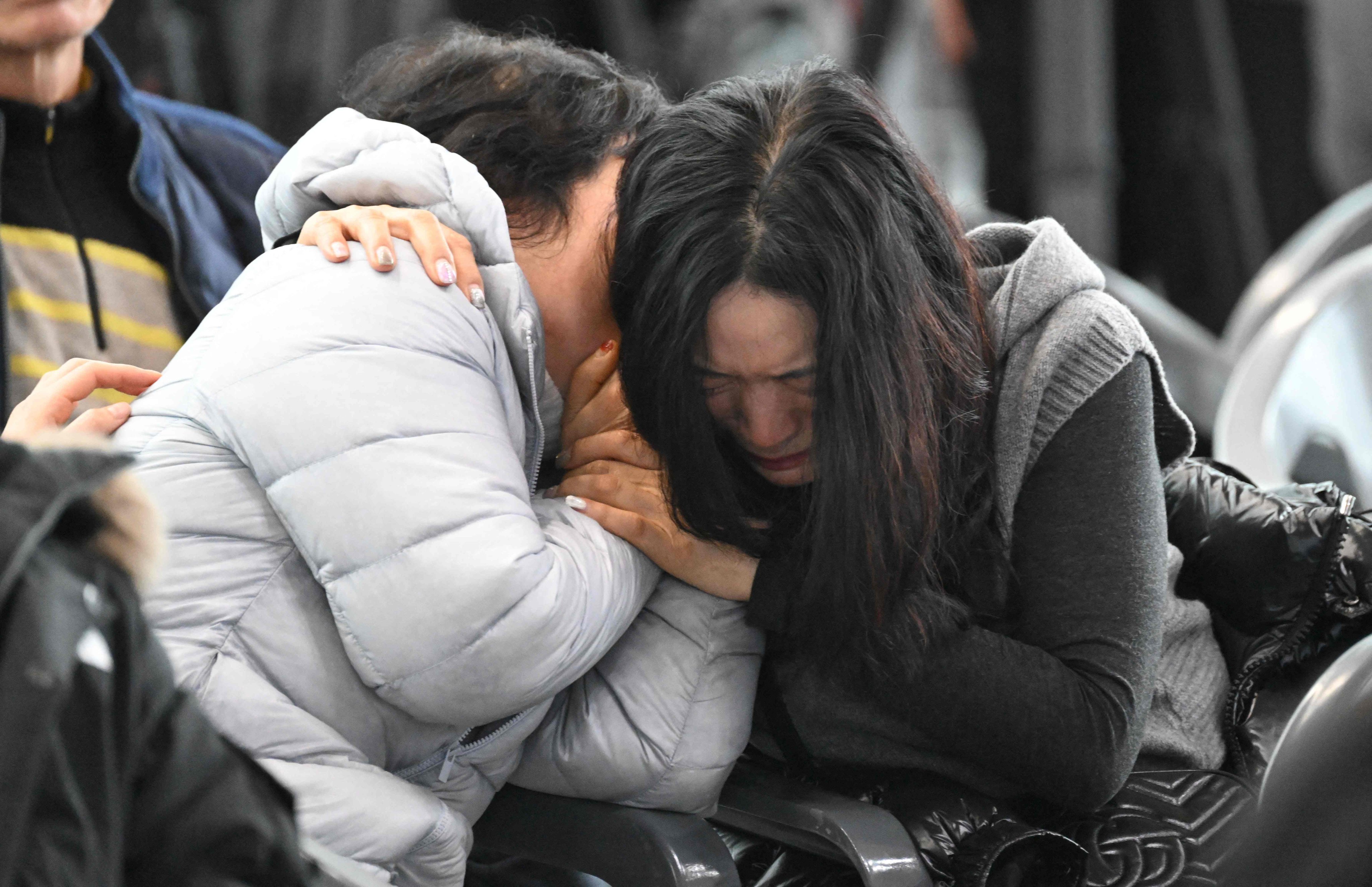 Jeju Air crash victims’ relatives at a makeshift shelter in Muan, South Korea. Photo: AFP