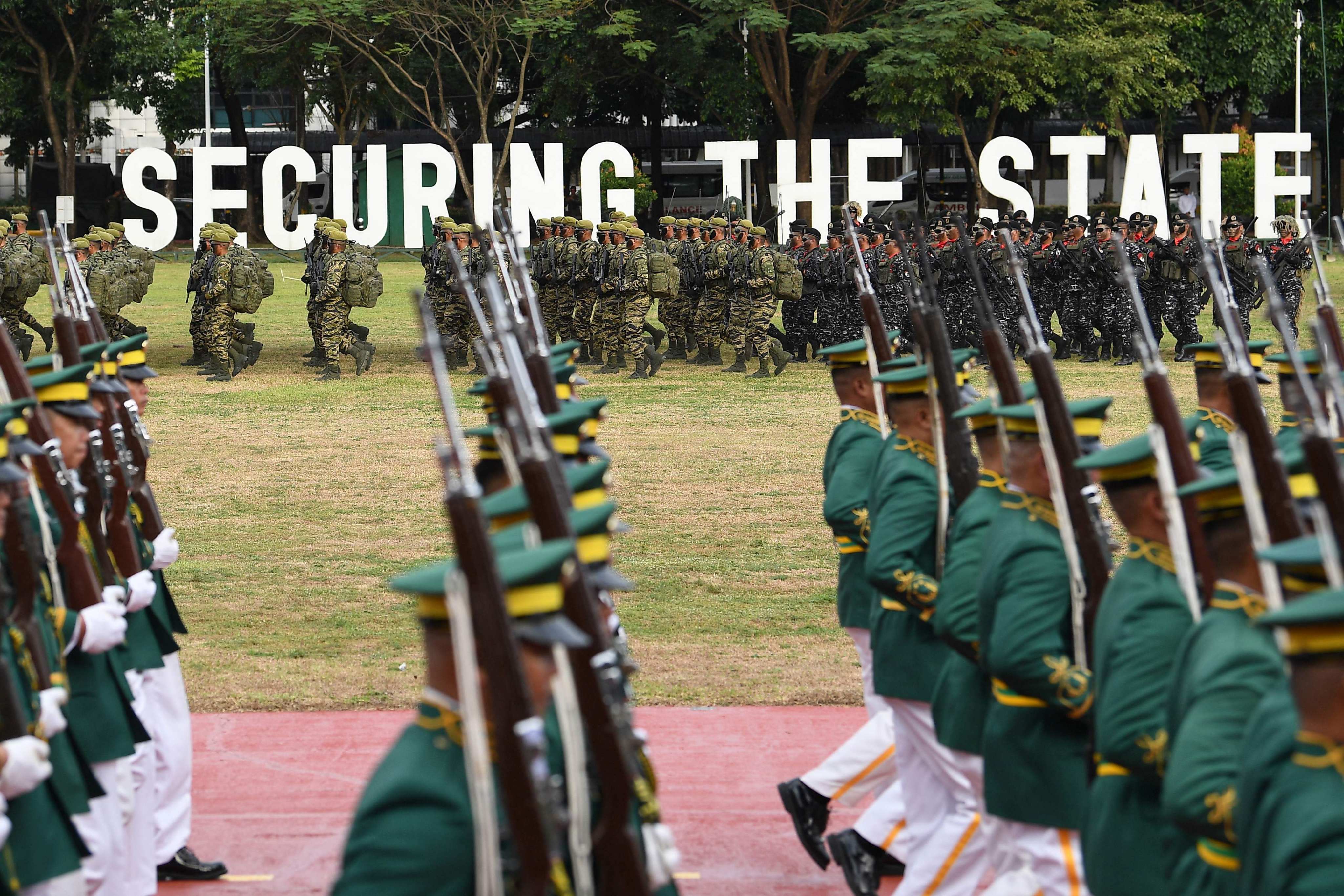 Soldiers march during a military parade held at Camp Aguinaldo 
in Quezon City last month to mark the 89th founding anniversary of the Philippine military. Photo: AFP