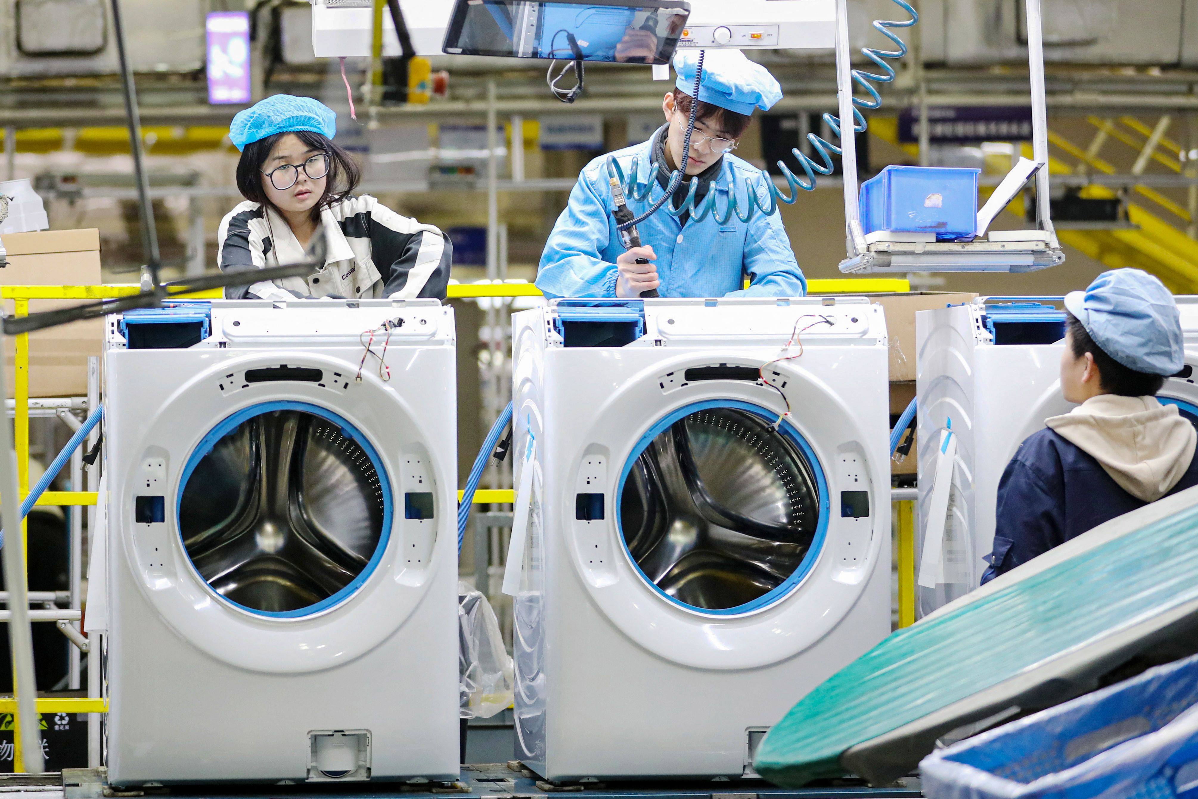 A washing-machine production line at a factory in China. The government has renewed its trade-in subsidy programme for home appliances in 2025. Photo: AFP